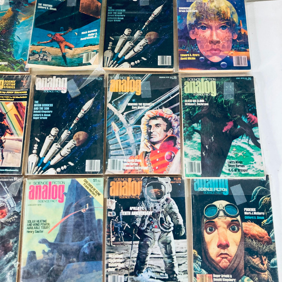 VTG Analog Science Fiction and Fact Magazine Lot of 19 1970s displaying a collection of 1970s sci-fi magazine covers with captivating artwork, including editions from January 1976, March 1979, and July 1979.