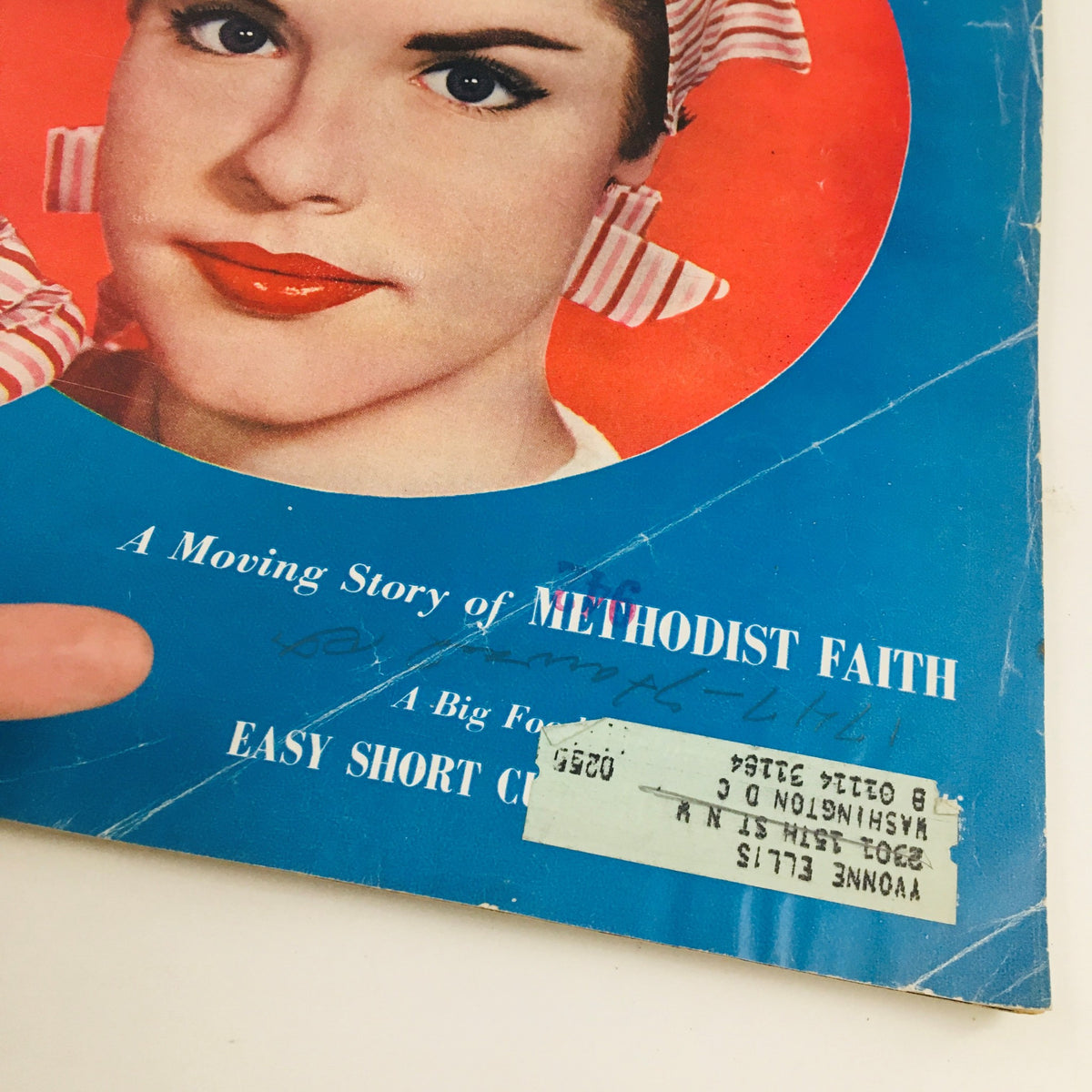 Close-up of the Woman's Home Companion May 1954 cover showing the address label and handwritten notes alongside the magazine's title regarding a moving story of Methodist faith.
