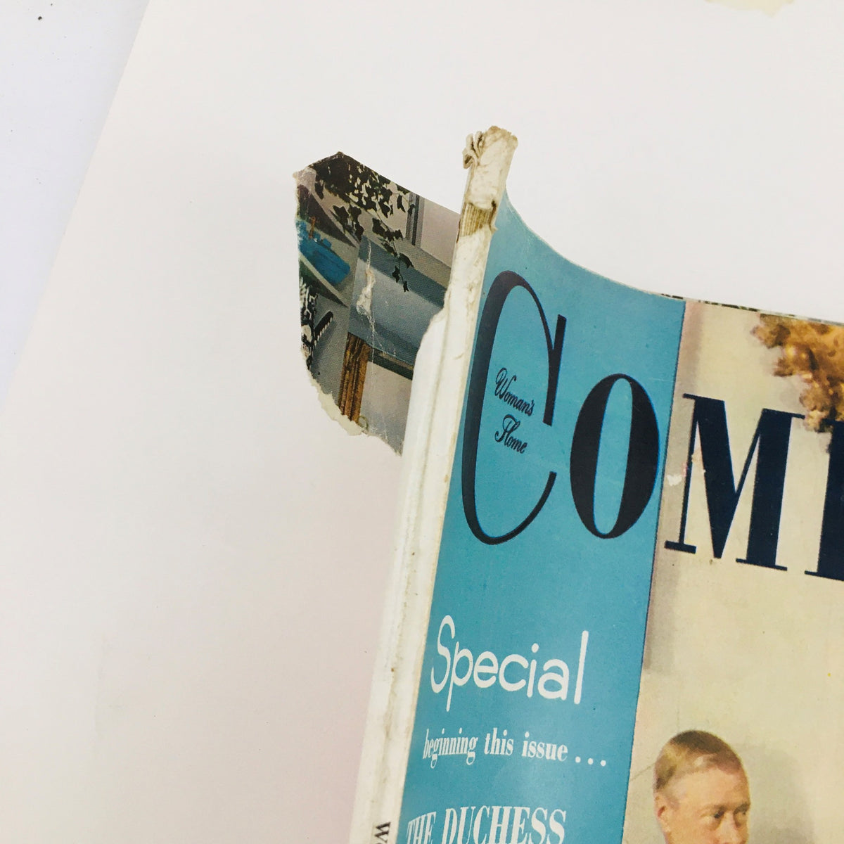 Spine and corner damage of Woman's Home Companion October 1954, highlighting wear and tear on the magazine cover.