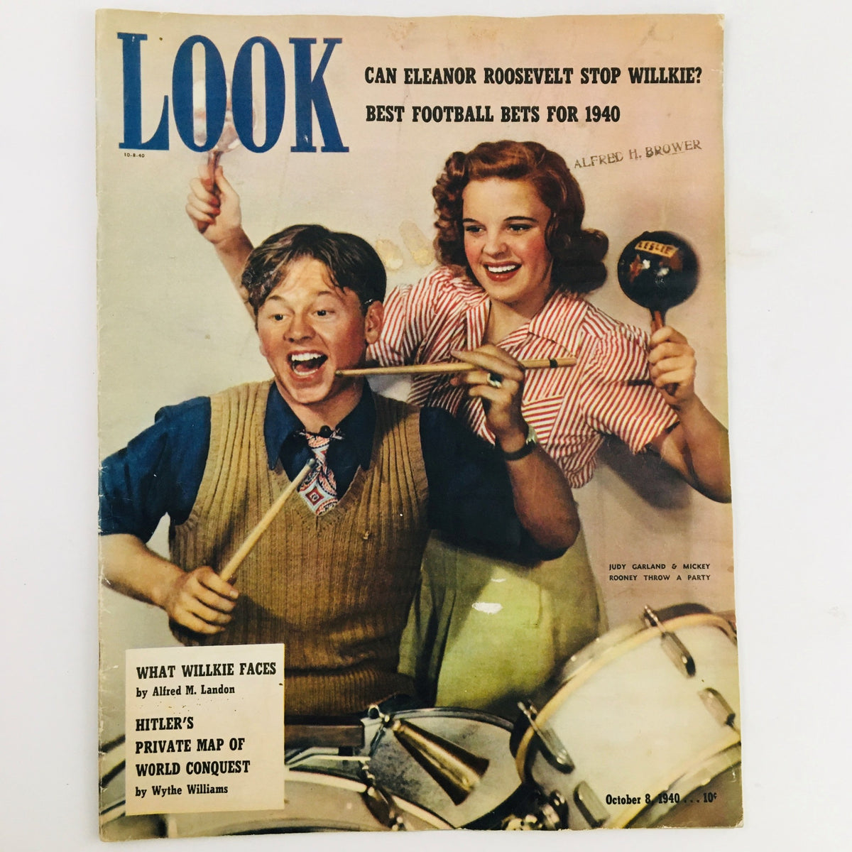Cover of Look Magazine from October 8, 1940 featuring Judy Garland and Mickey Rooney celebrating at a party, showcasing vintage Hollywood charm.