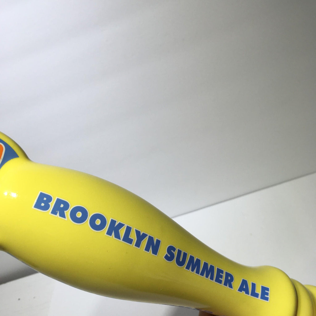 Vintage Brooklyn Summer Ale beer tap handle featuring bold lettering and bright yellow design.