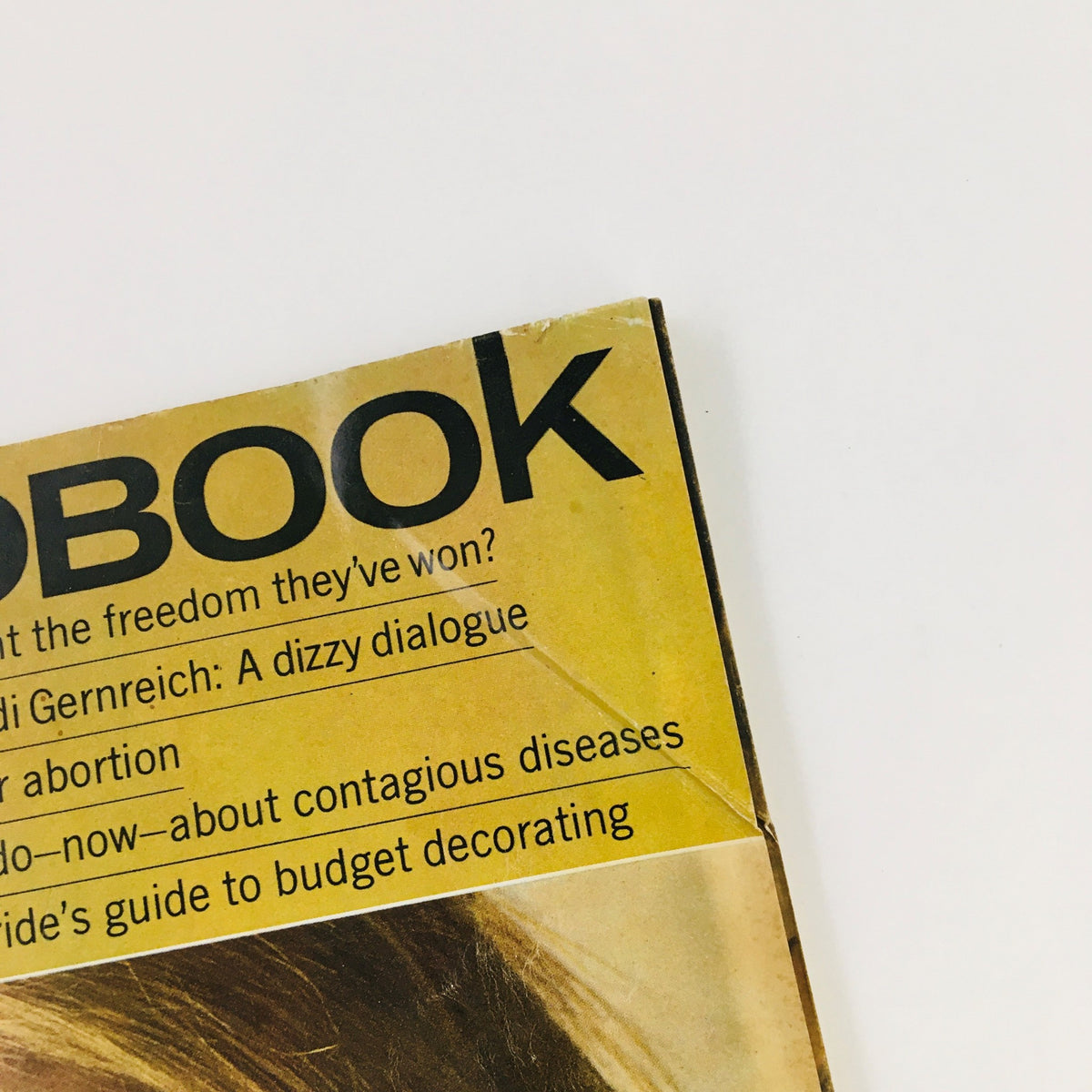 Top angle view of Redbook Magazine May 1967 displaying key discussion topics, including women’s freedom and a bride’s guide to decorating.