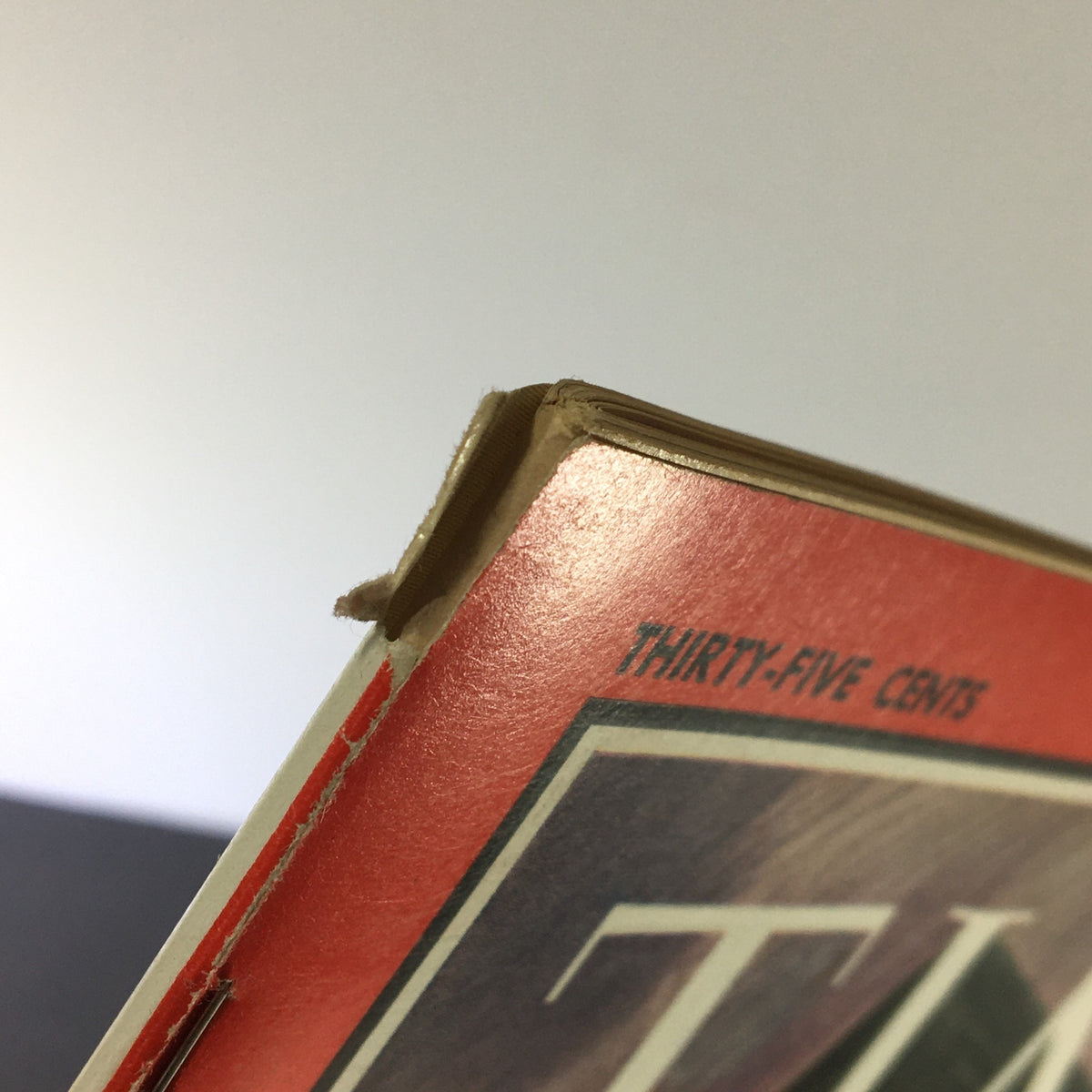 Close-up view of VTG Time Magazine February 25 1966, highlighting the top edge showing minor wear typical for a vintage publication.