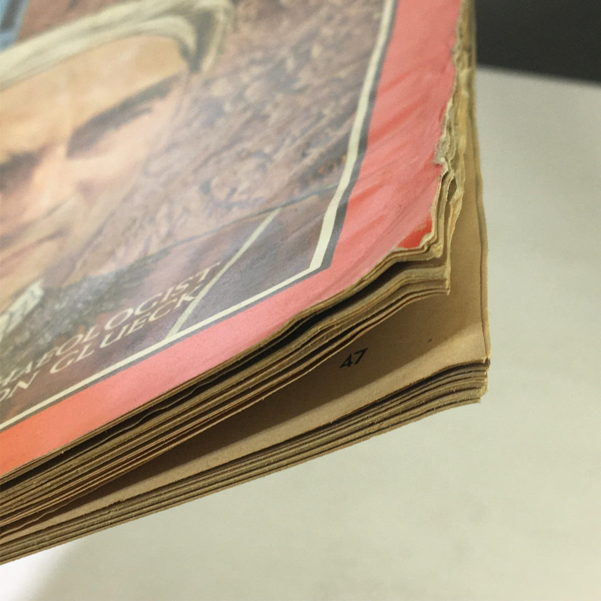 Close-up view of the edge of the vintage Time Magazine December 13, 1963, highlighting the condition and detailing of Vol. 82 No. 24 featuring archaeologist Nelson Glueck.