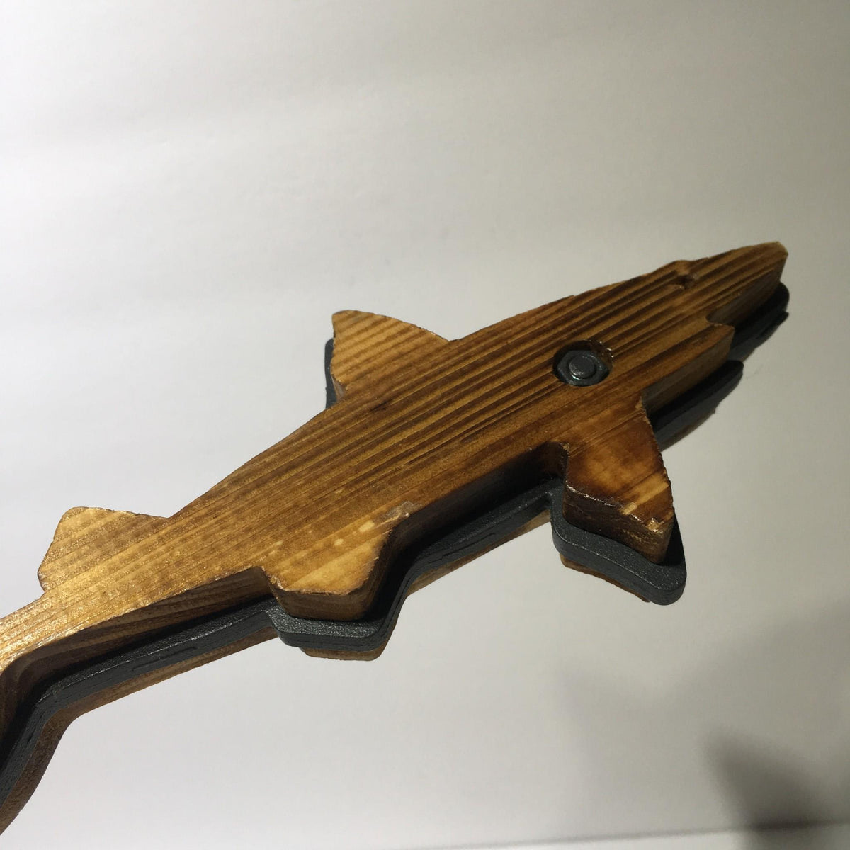 Close-up of the wooden part of a Vintage Dogfish Head 60 Minute IPA 12" Beer Tap Handle, showcasing its rustic design.