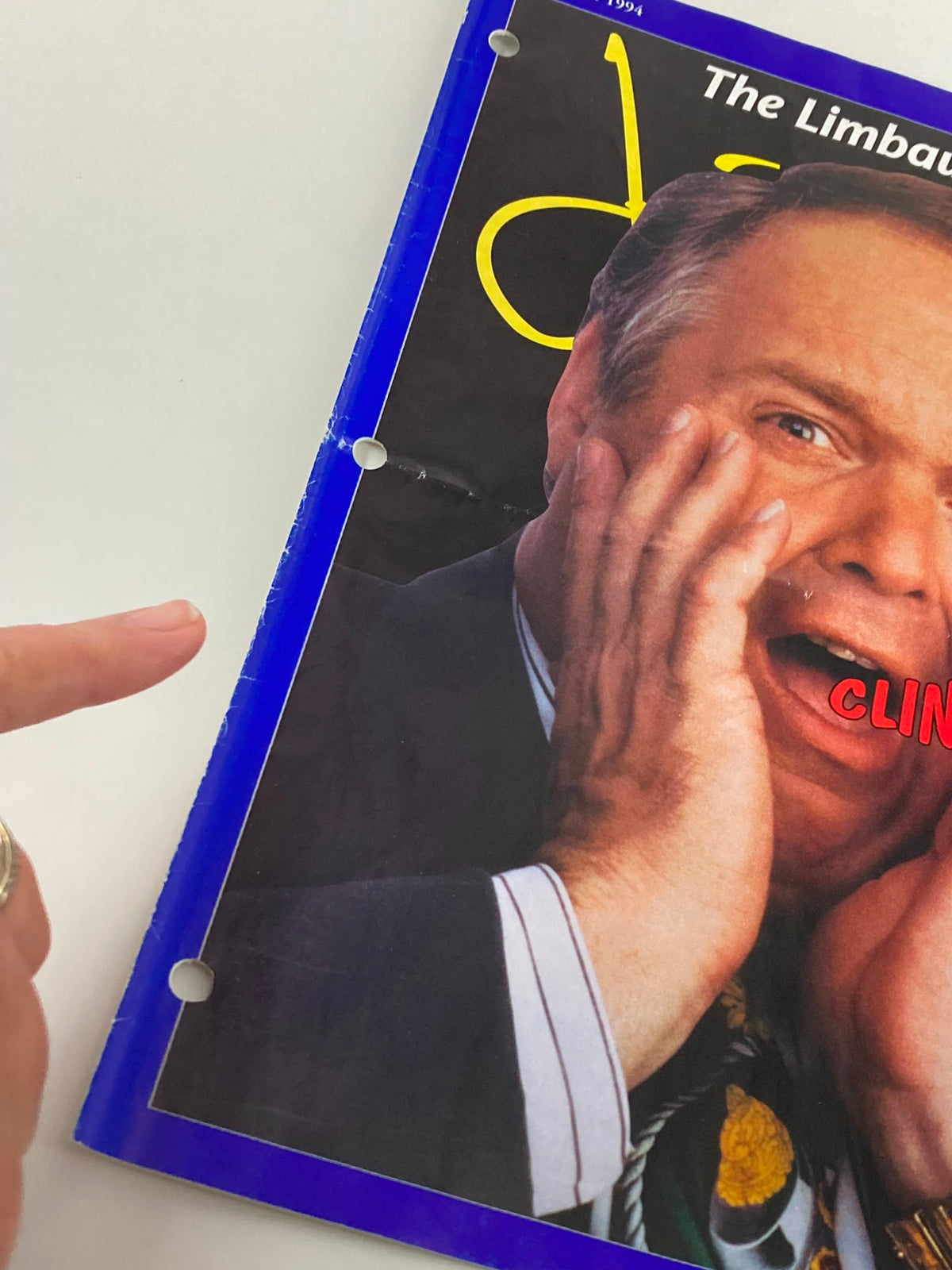Close-up of the Rush Limbaugh Letter Magazine November 1994 cover showcasing detailed visuals, including hole punches from being part of a binder, emphasizing its collectible nature related to 'The Clinton Economy'.