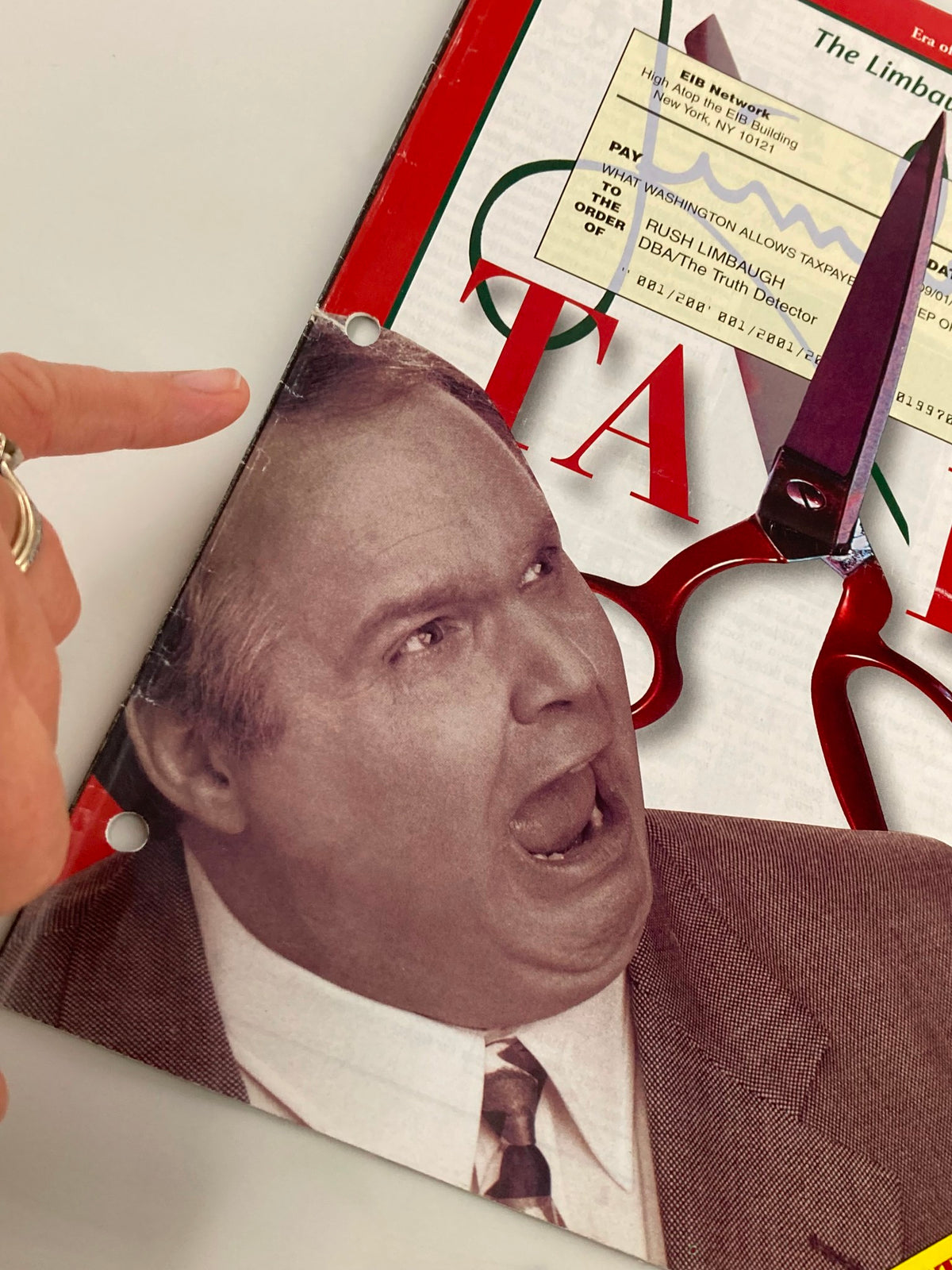 Close-up of the cover of the Rush Limbaugh Letter Newsletter Magazine from September 1997, highlighting Rush Limbaugh's face and the associated taxation theme with a pair of scissors prominently displayed.
