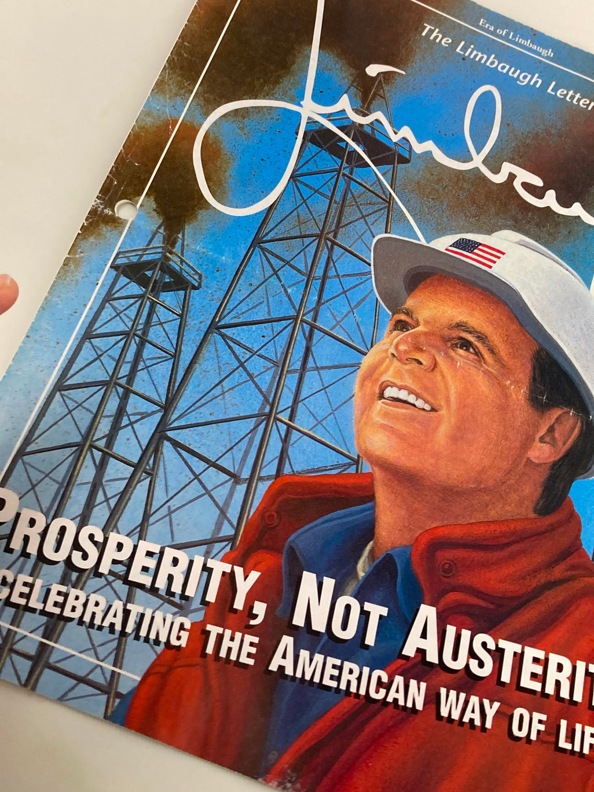 Close-up of the Rush Limbaugh Letter Newsletter Magazine July 2001 'Prosperity, Not Austerity' showcasing Rush Limbaugh's signature with oil rigs in the background, emphasizing the theme of American prosperity.