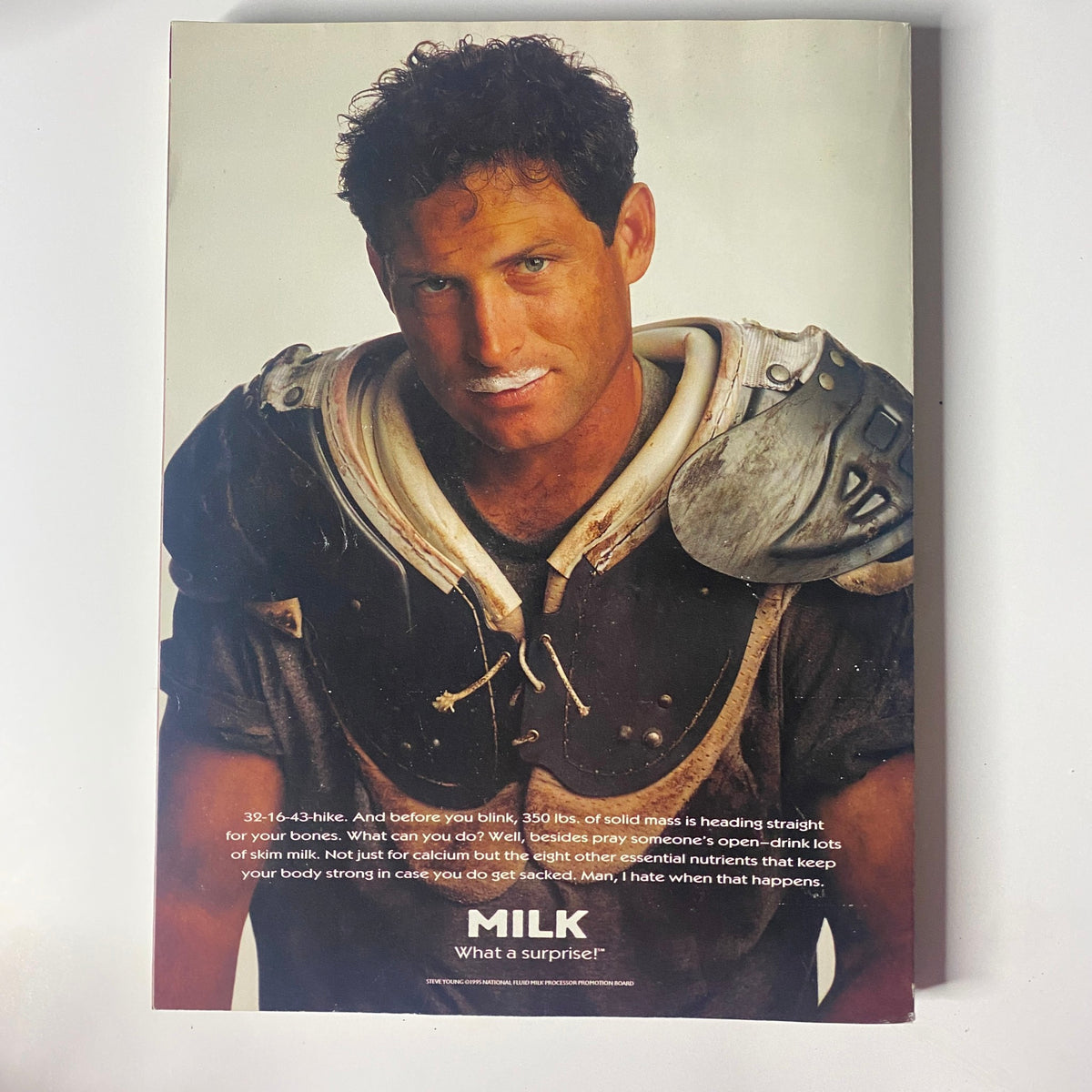 Back cover of Muscle & Fitness Magazine August 1996, featuring a football player with a milk mustache, promoting the benefits of milk for strong bones and nutrition.