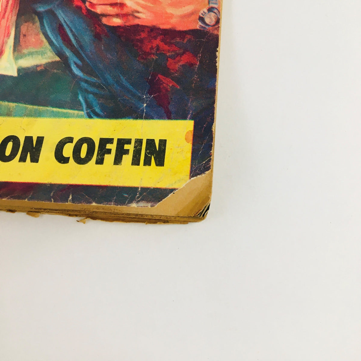 Close-up of the lower corner of Battle Station Magazine November 1961, showcasing the title Cast Iron Coffin, highlighting its classic appeal.