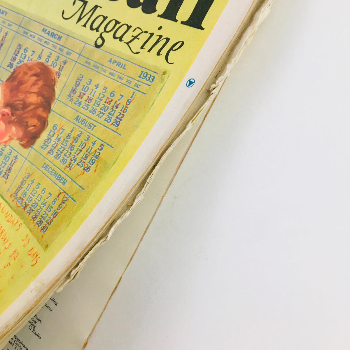 Close-up view of The American Magazine January 1933 cover displaying the title and calendar pages, emphasizing its collectible value and cultural insights.