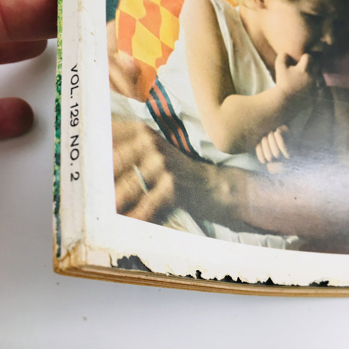 Spine view of Redbook Magazine June 1967 displaying volume number and signs of aging.