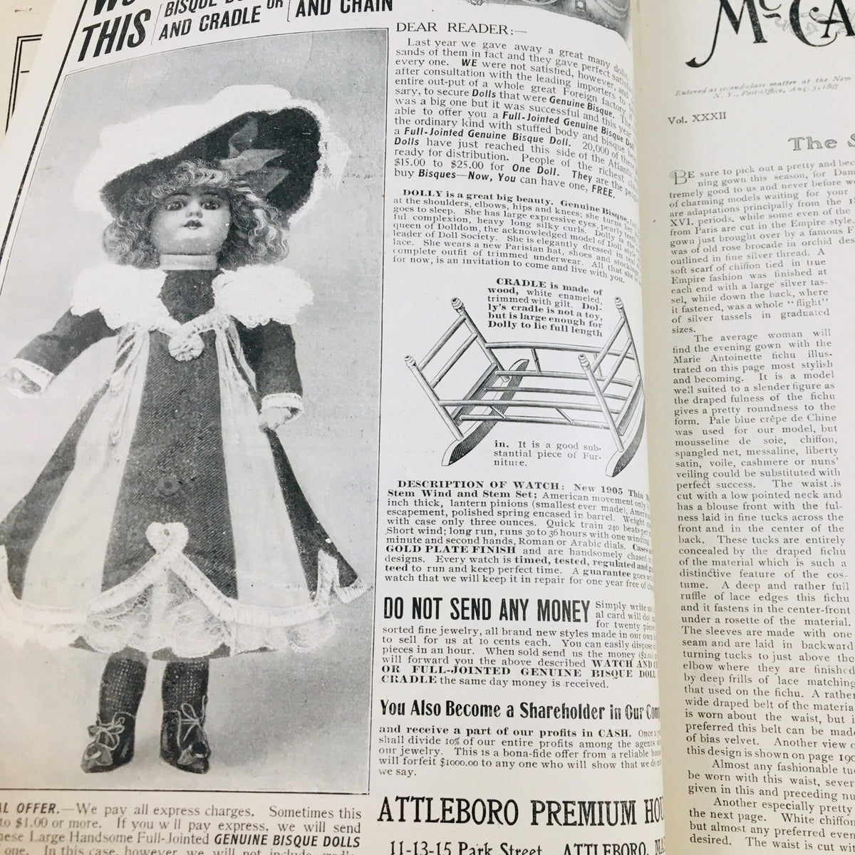 Advertising illustration from VTG McCall's Magazine November 1904 featuring a vintage bisque doll in a stylish outfit, promoting a cradle and chain.