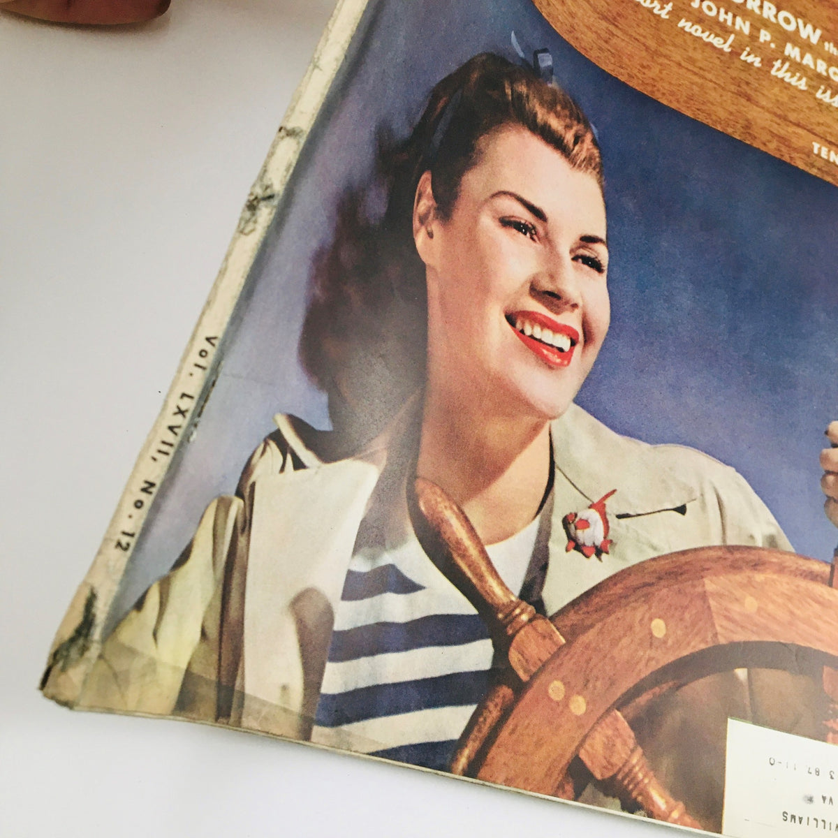 Close-up of the cover of VTG McCall's Magazine September 1940, showcasing the title 'Gone Tomorrow: The Story of Why Man Marries' and a smiling woman in a striped outfit.