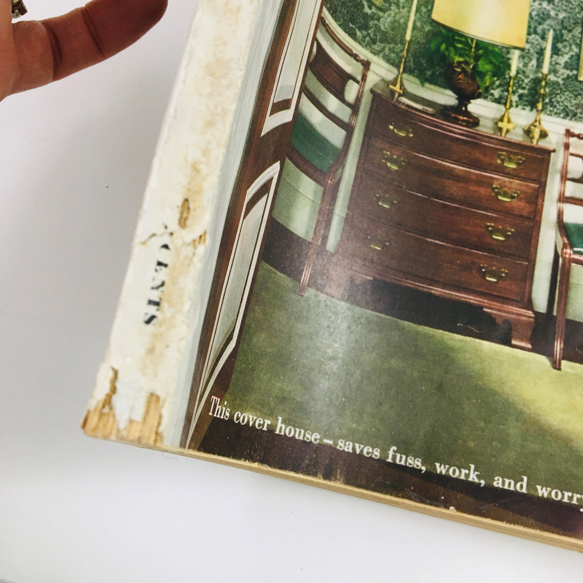 Better Homes & Gardens Magazine March 1949 displaying a vintage interior design featuring a wooden dresser and green chairs, illustrating home decor ideas for hillside living.