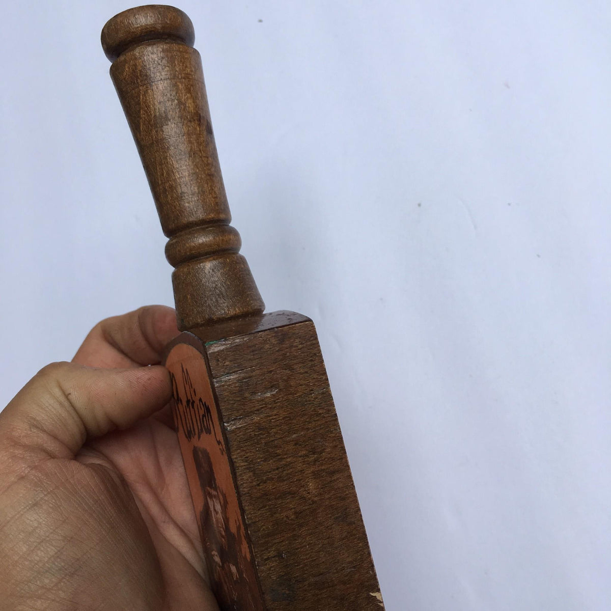 Side view of Vintage Ruffian Porter Wooden 10" Beer Tap Handle highlighting its elegantly designed top and handle.