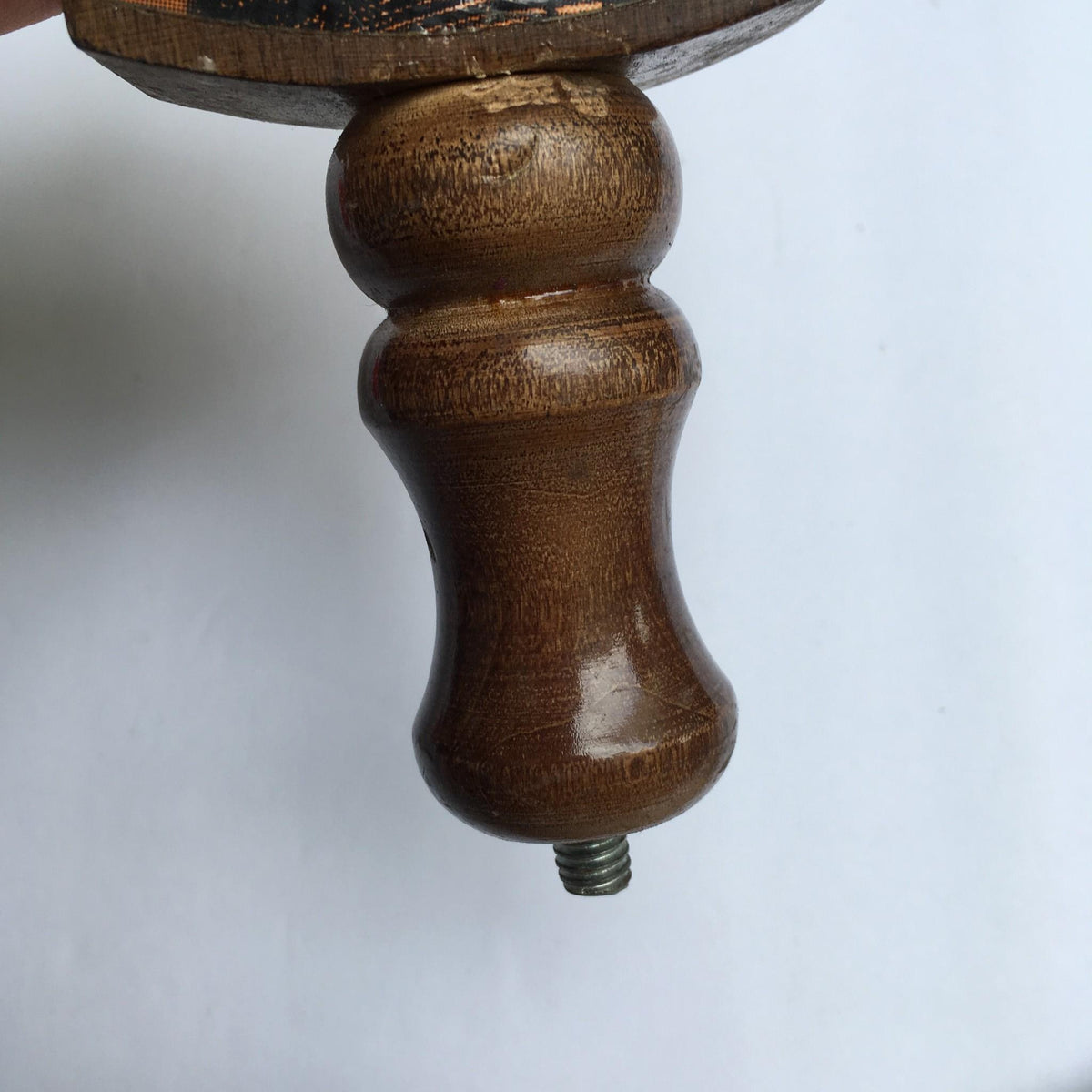 Detailed view of the bottom section of Vintage Ruffian Porter Wooden 10" Beer Tap Handle, featuring a smooth, contoured grip and threaded connector.