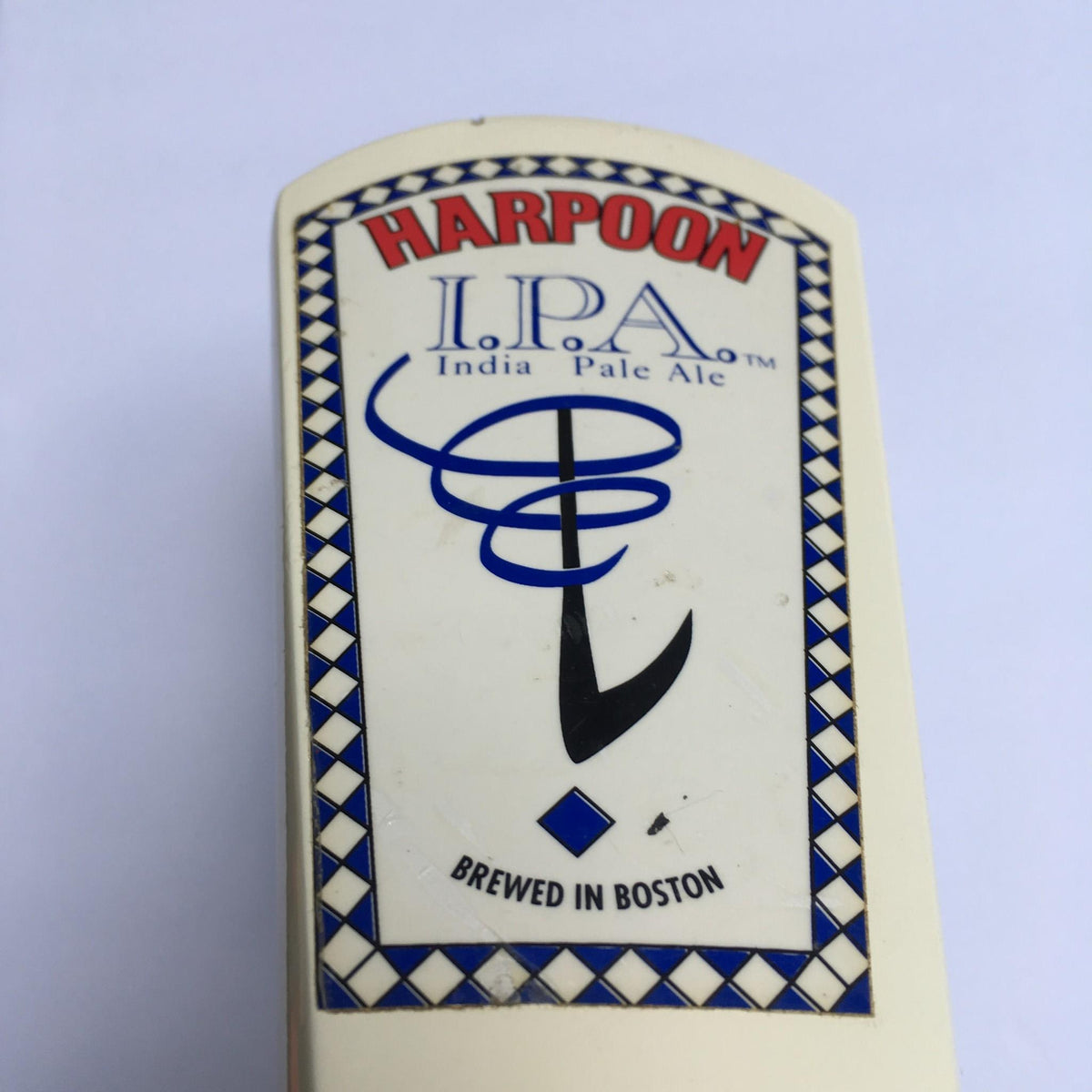 Top view of the Vintage Harpoon IPA Indian Pale Ale beer tap handle, highlighting the logo and branding details.