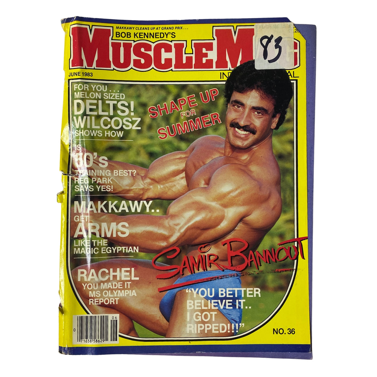 MuscleMag International Magazine June 1983 No. 36 featuring Samir Bannout on the cover, showcasing his muscular physique and the title 'Shape Up Summer.' The magazine is associated with bodybuilding culture and fitness.