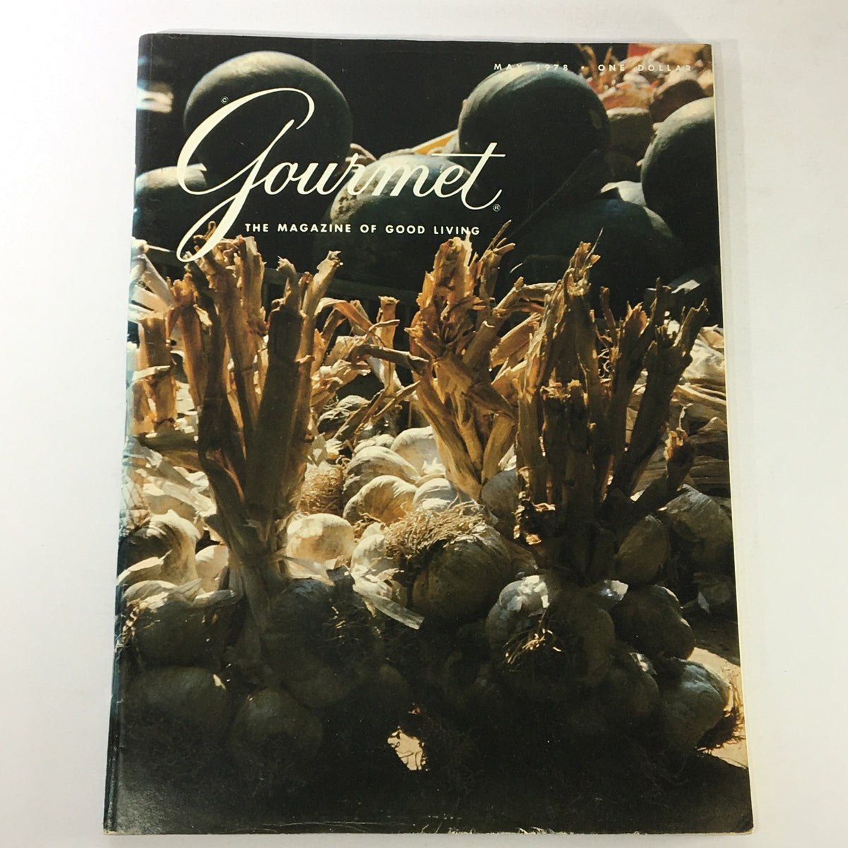 Cover of VTG Gourmet The Magazine of Good Living May 1978 featuring artistic arrangement of garlic and onions, highlighting culinary themes.