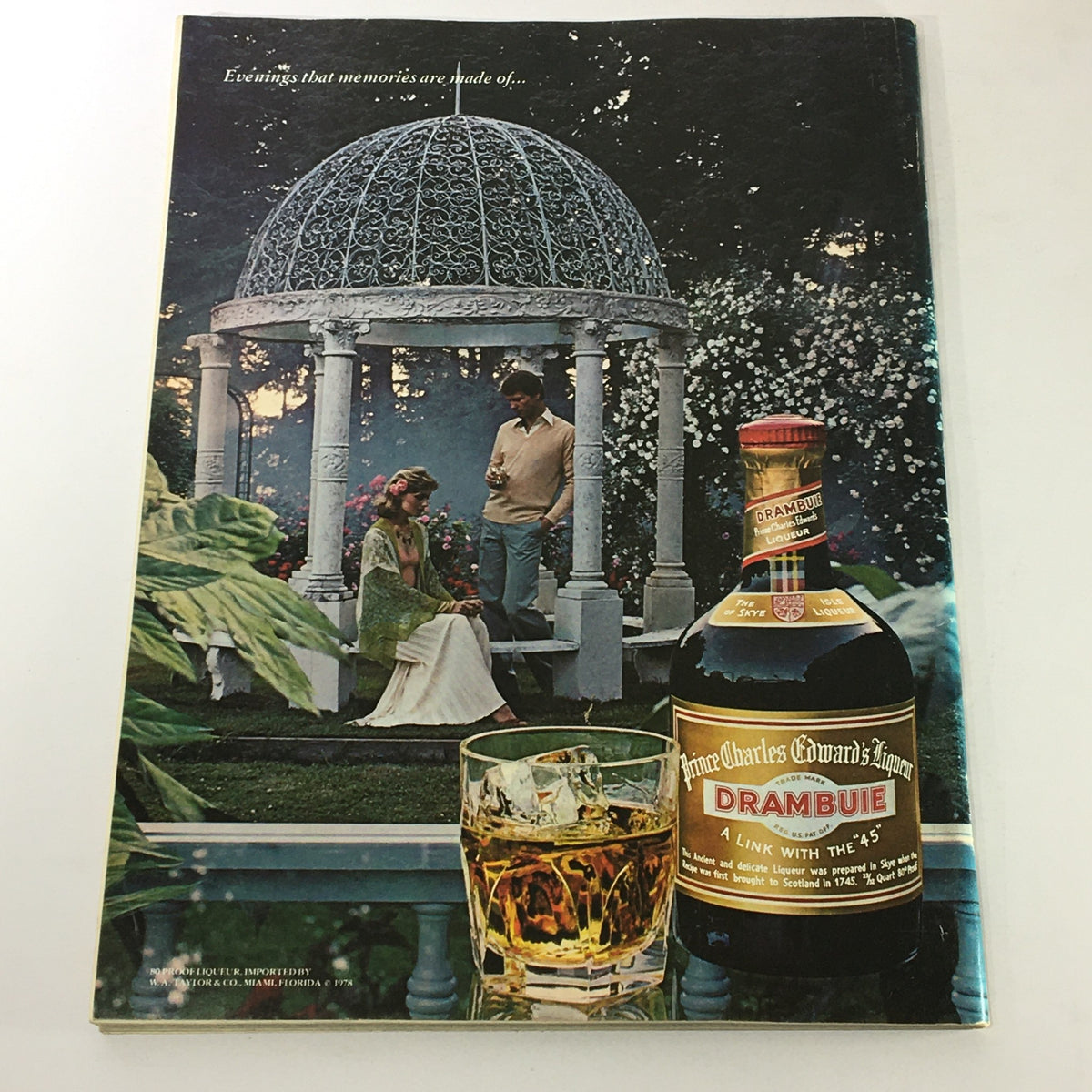 Cover of VTG Gourmet Magazine May 1978 featuring a romantic outdoor scene with a woman in a white dress and a man holding a drink beside a gazebo, highlighting the elegance of fine dining and wines.