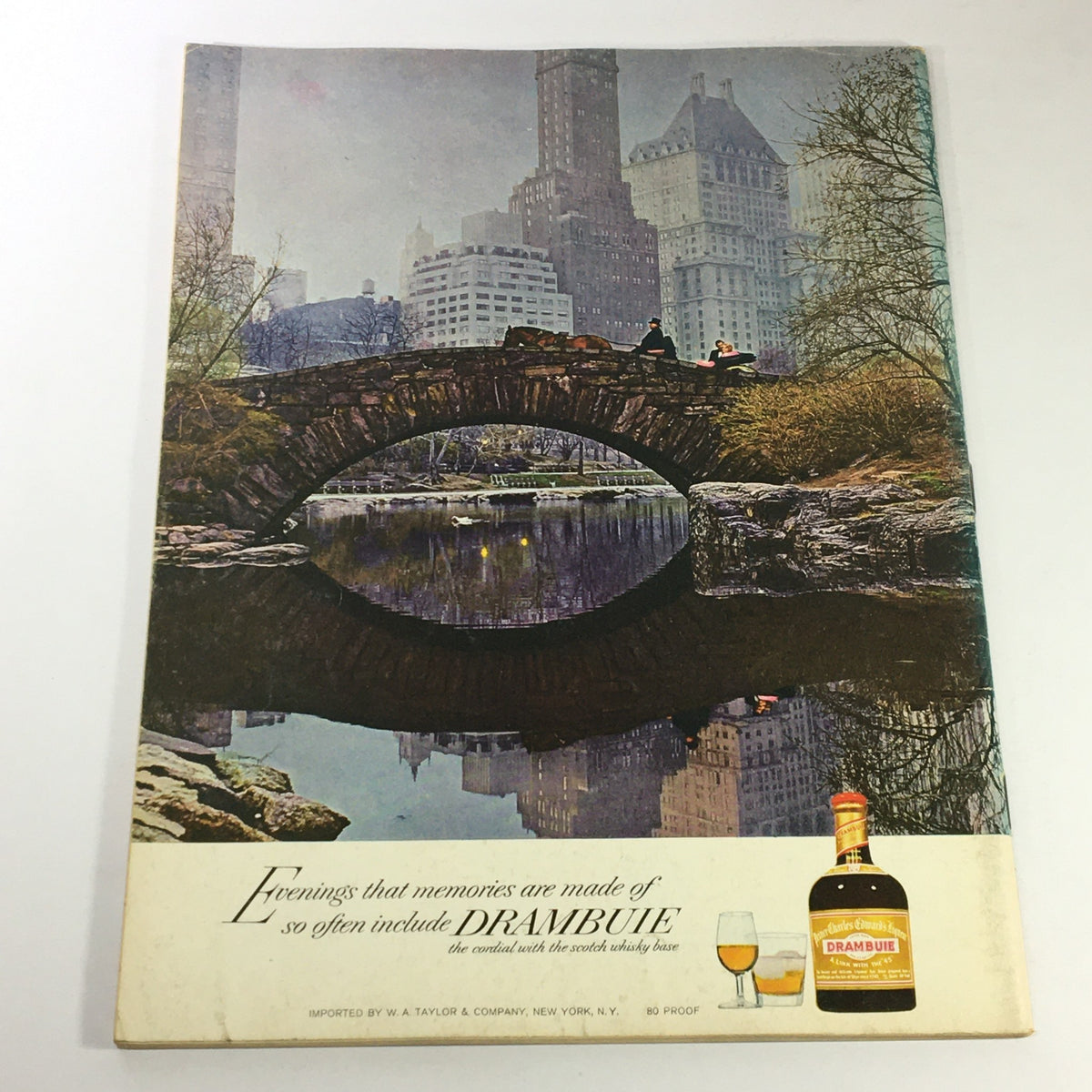 Back cover of VTG Gourmet The Magazine of Good Living May 1970 with an advertisement for Drambuie and a scenic view of a bridge in a city park.