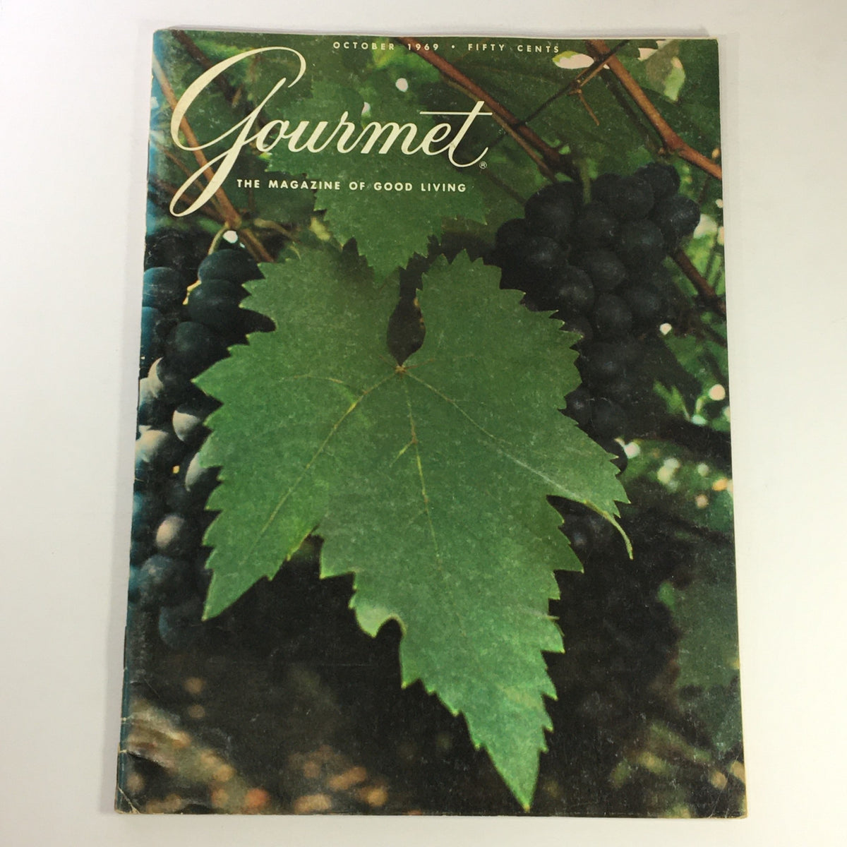 Cover of VTG Gourmet The Magazine of Good Living October 1969 featuring lush green leaves and dark grapes, showcasing Turkish cooking art.