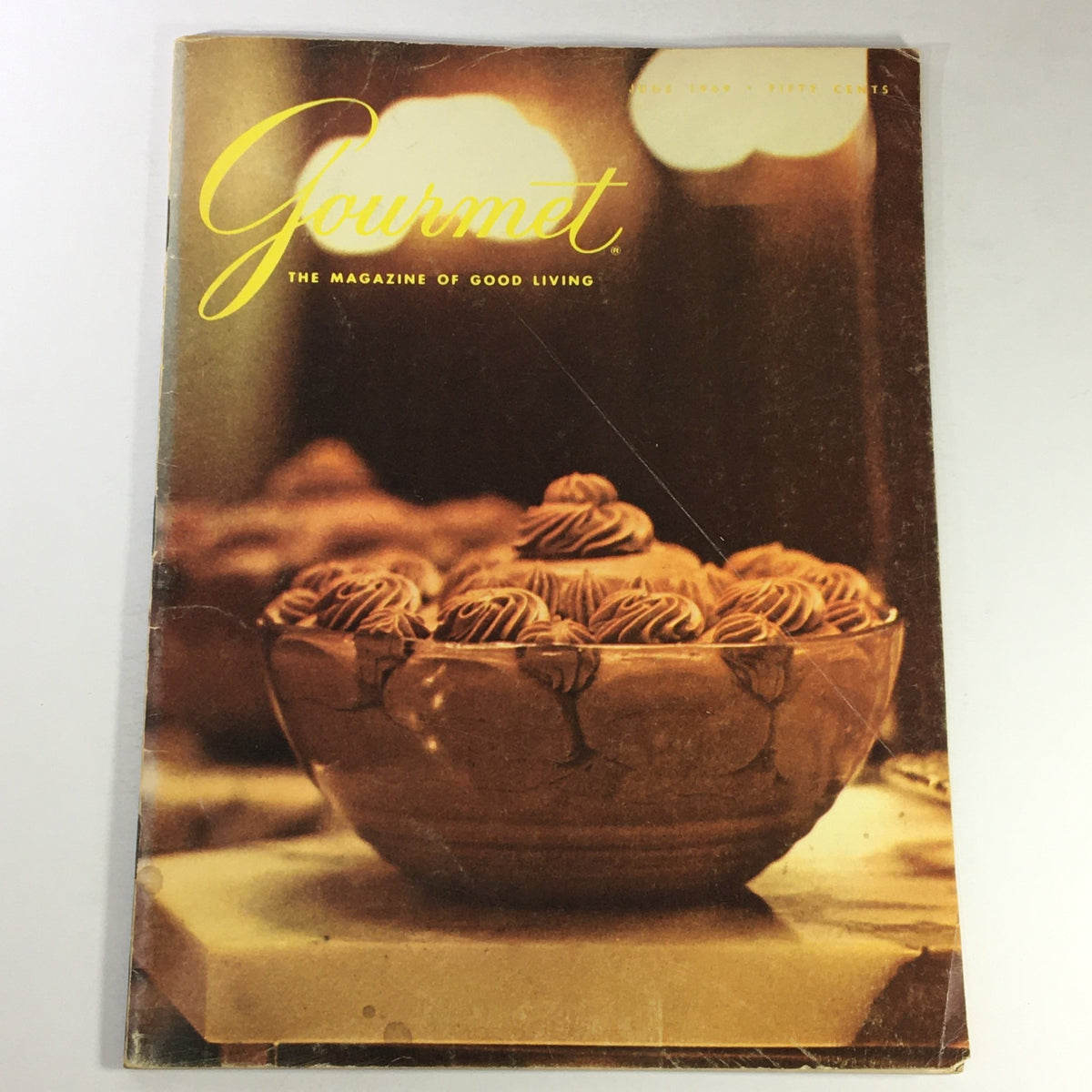 Cover of VTG Gourmet The Magazine of Good Living June 1969 featuring a decorative punch bowl filled with treats, reflecting the theme of 'The Silver Punch Bowl.'
