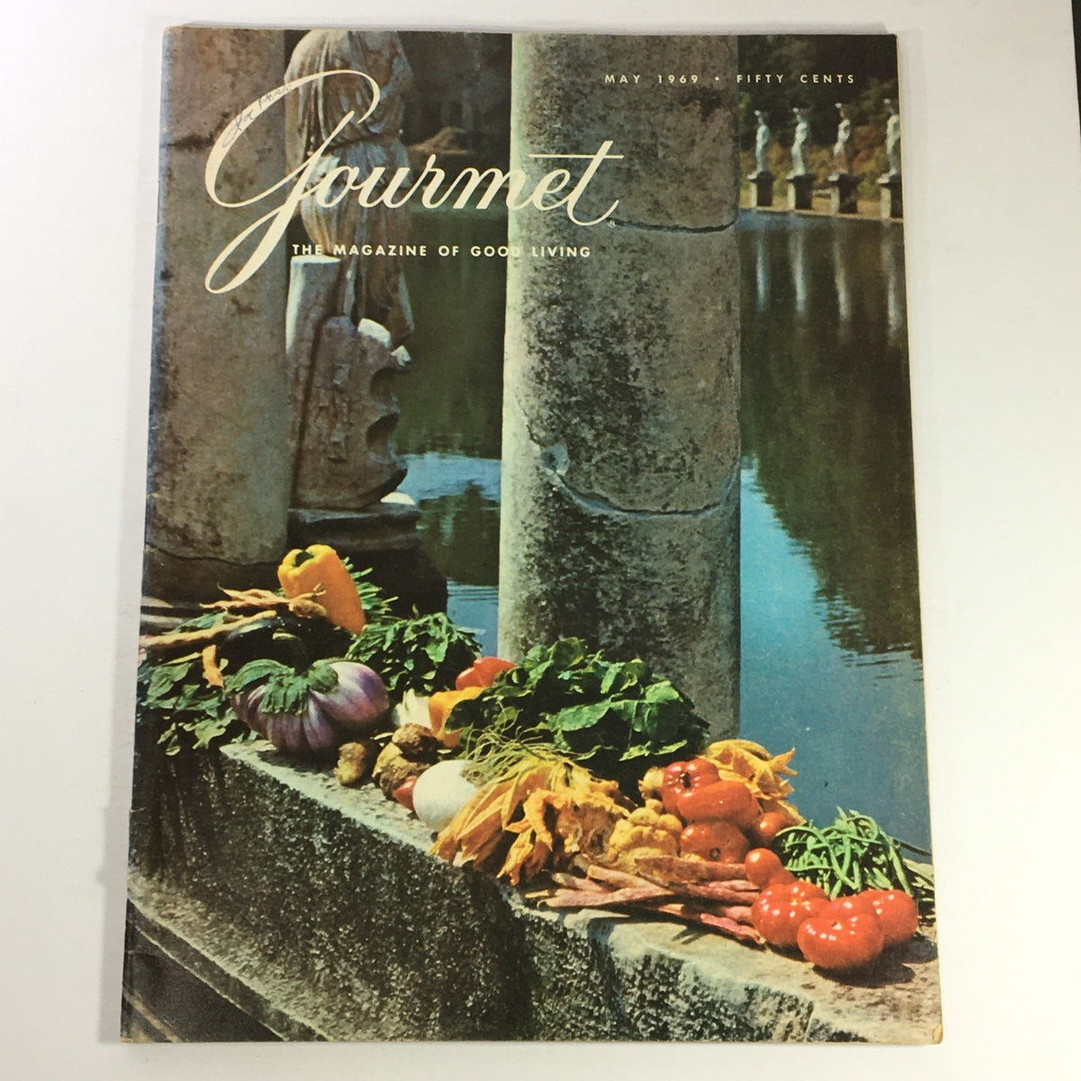 Cover of VTG Gourmet Magazine, May 1969 issue titled 'A Feast in Bengal', featuring a colorful arrangement of fresh vegetables and a serene water backdrop, illustrating the magazine's focus on culinary culture.