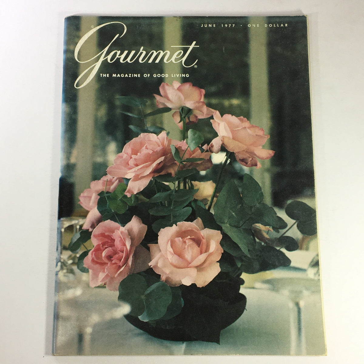 Cover of VTG Gourmet The Magazine of Good Living June 1977 featuring pink roses in a vase, highlighting the editorial focus on culinary culture and travel.