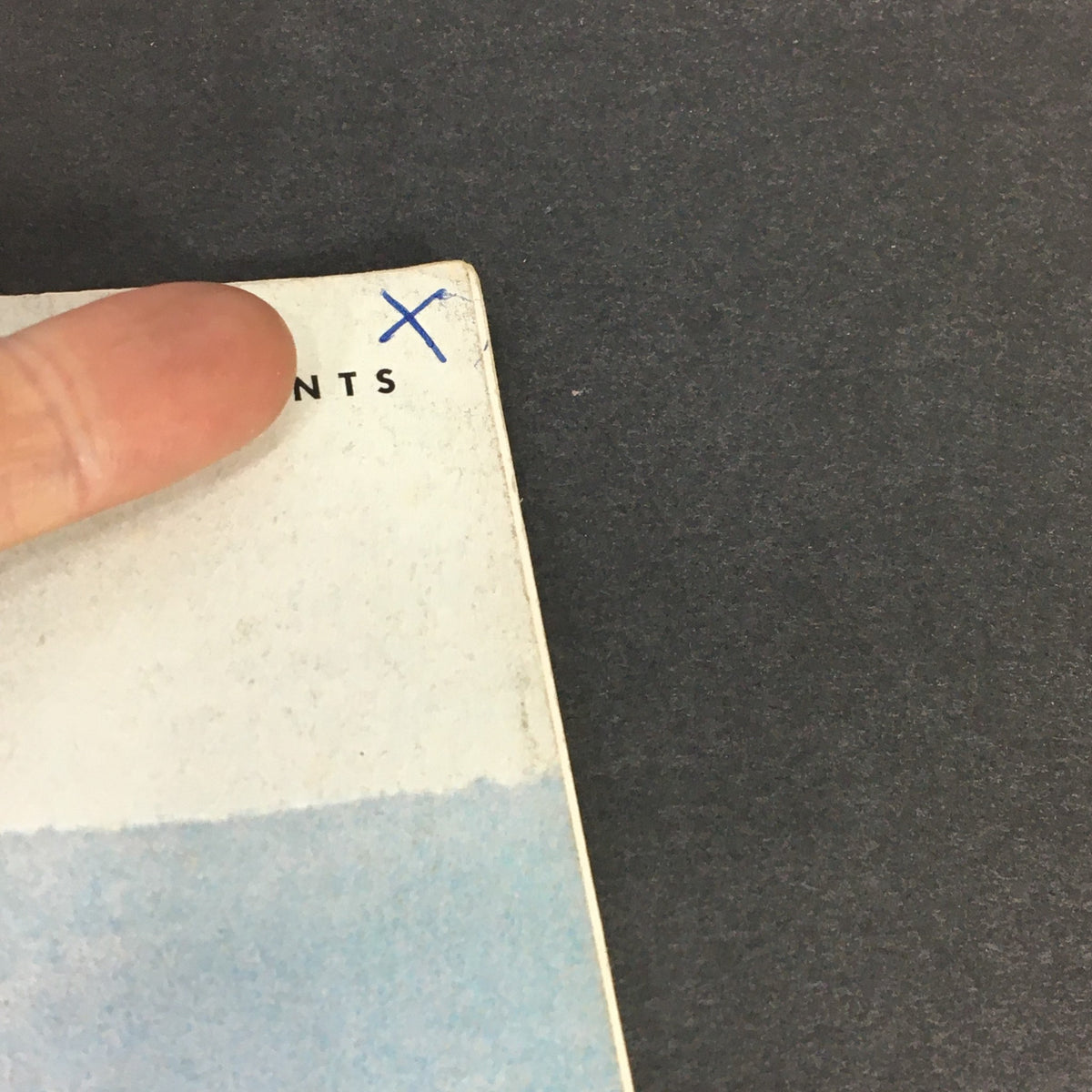 Detail of the VTG Gourmet The Magazine of Good Living April 1975 cover showing a handwritten blue X mark and the magazine's price, adding character to this vintage collectible.