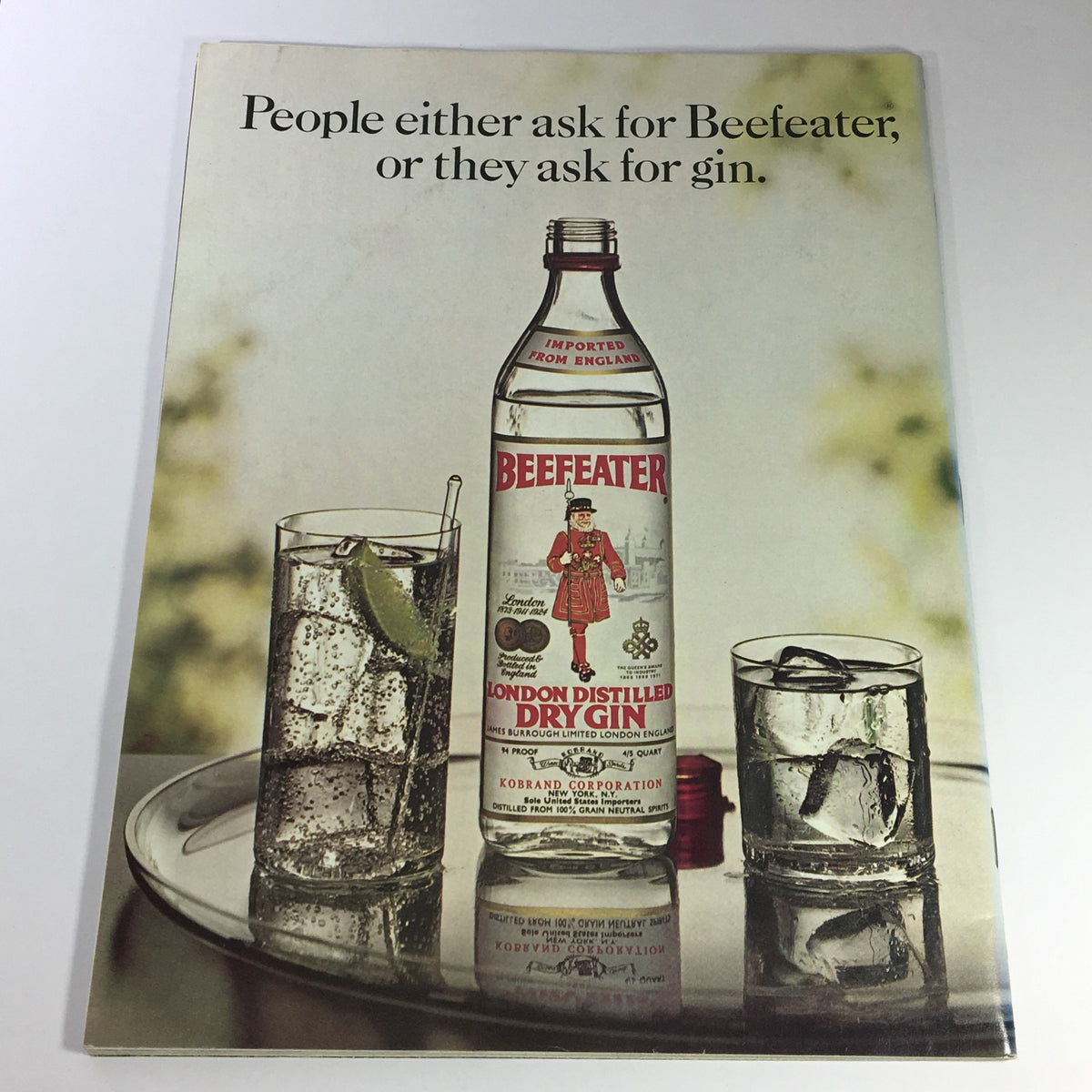 Vintage advertisement for Beefeater Gin featuring the bottle and two mixed drinks, accompanying the June 1973 issue of Gourmet: The Magazine of Good Living with an Irish Dinner Cruise theme.