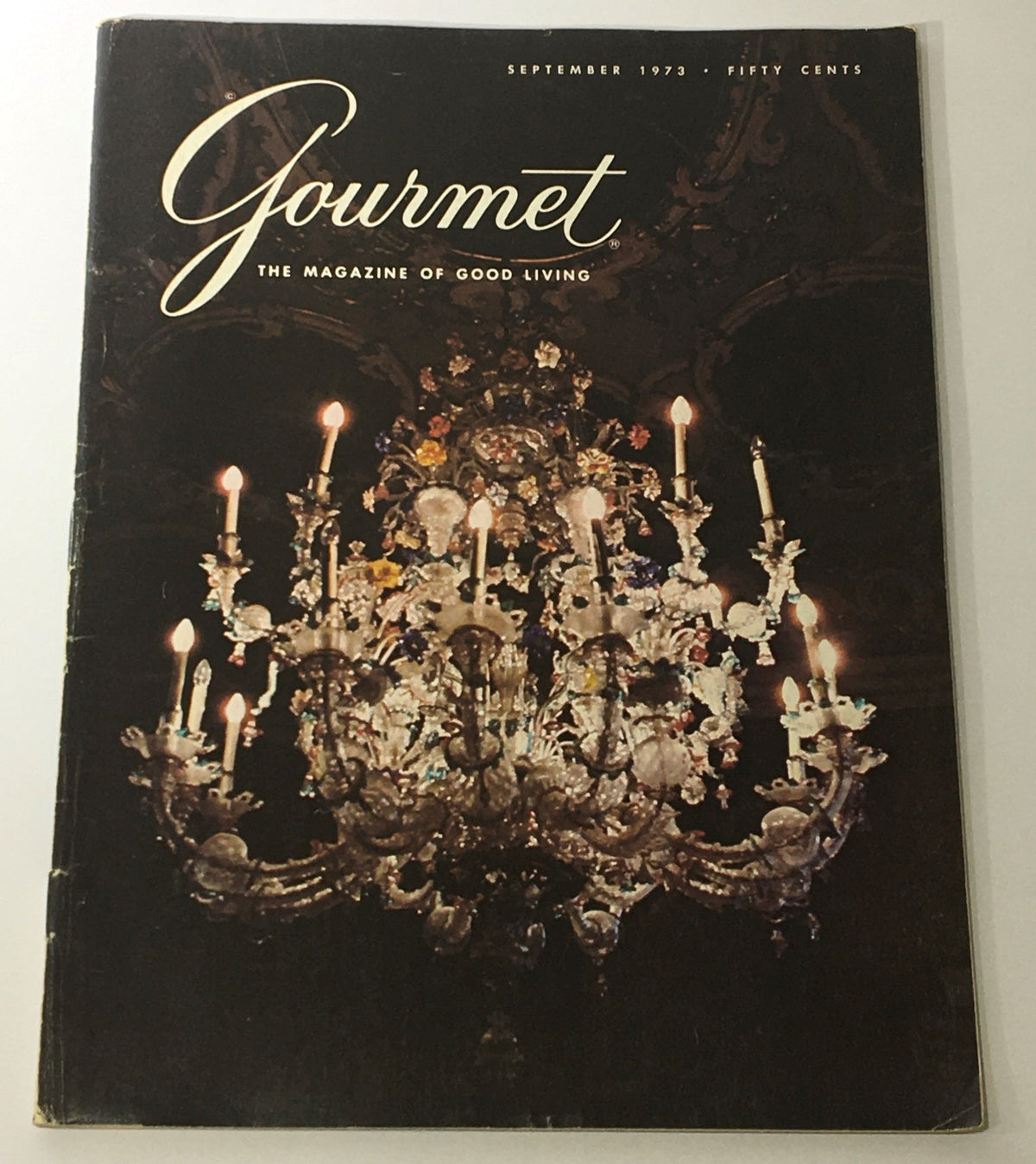 Cover of VTG Gourmet The Magazine of Good Living September 1973 featuring a beautiful chandelier, illustrating the elegance of fine dining and culinary culture.