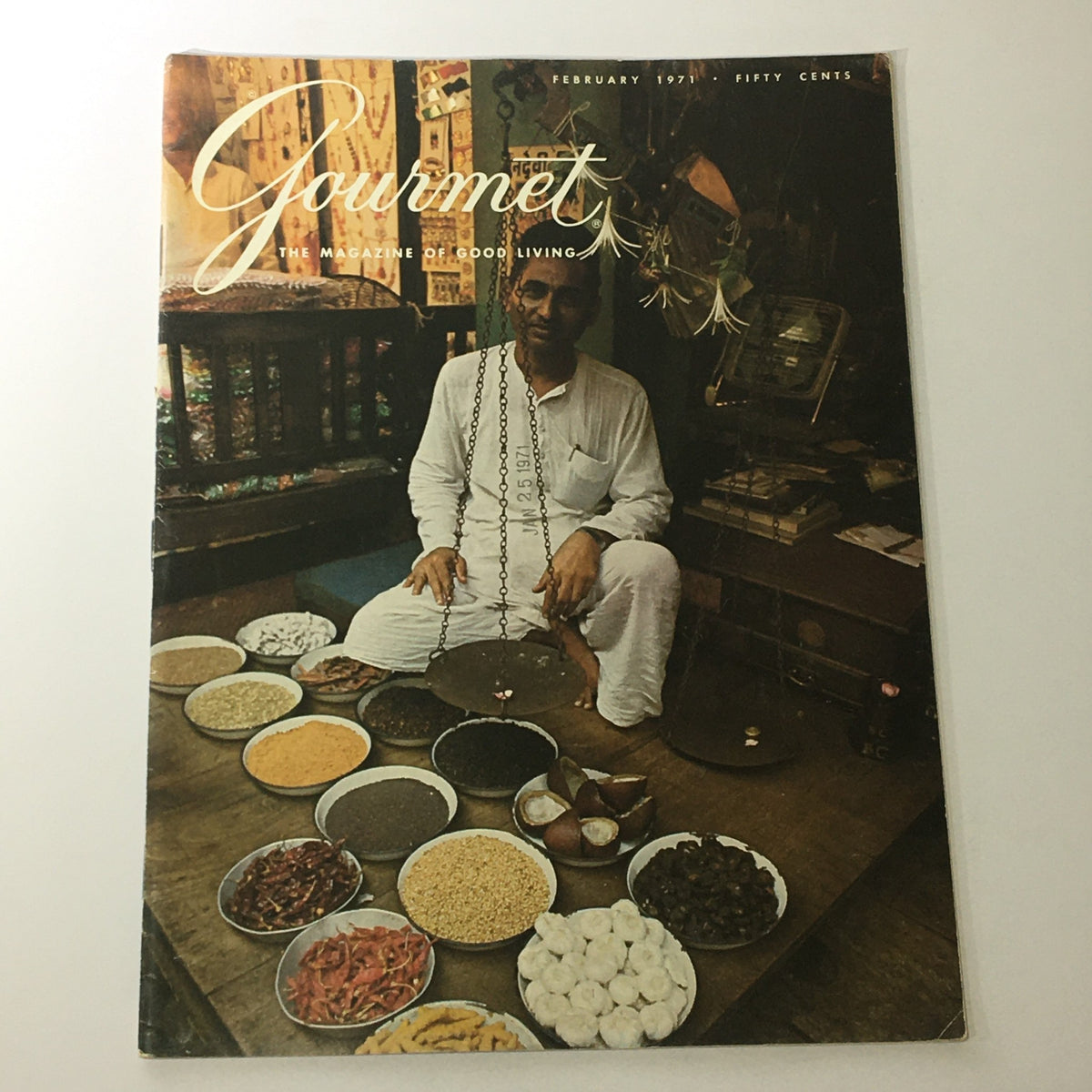 Cover of VTG Gourmet The Magazine of Good Living February 1971, showcasing a man in white attire surrounded by bowls of spices, highlighting the culinary culture of Ischl, The Emperor's Spa.