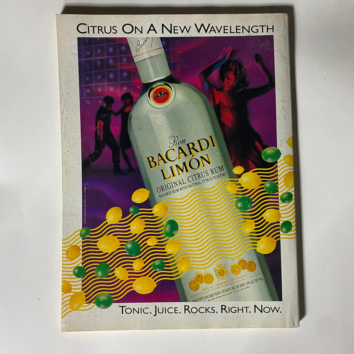Advertisement page from Street & Smith's Pro Basketball Magazine, featuring Ron Bacardi Limón Rum with vibrant graphics and dancing figures.