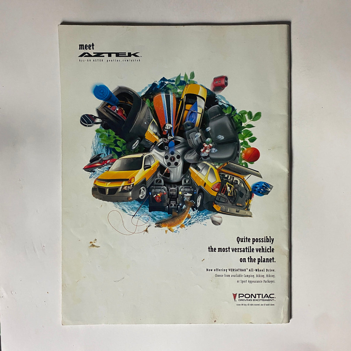 Promotional page for a Pontiac Aztek in People Weekly Extra Magazine Spring 2001 All About Survivor, illustrating the vehicle with various objects.