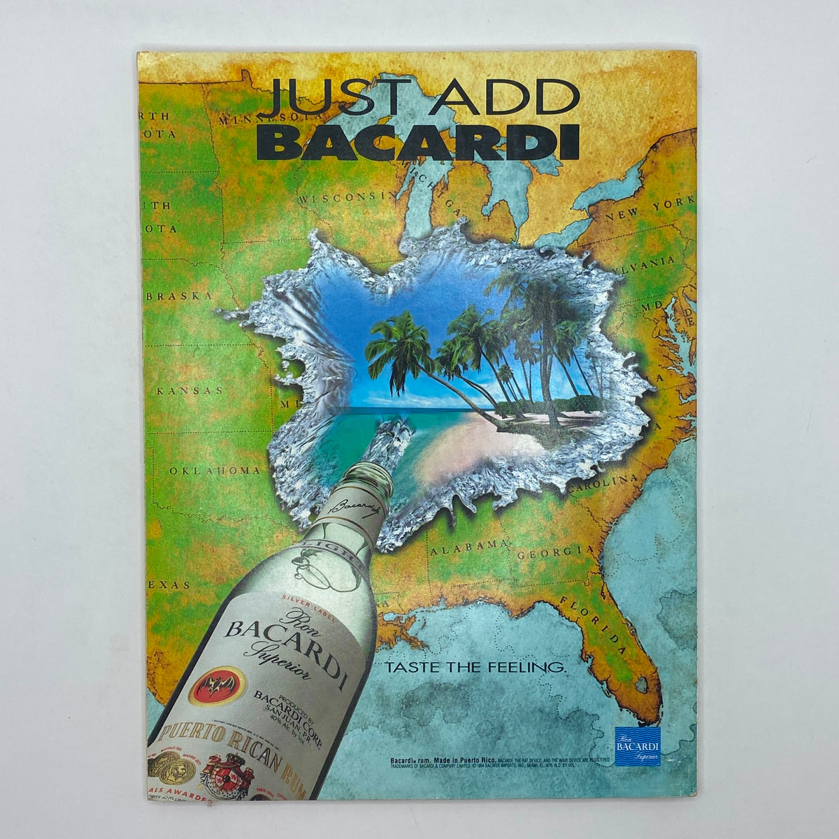 Cover of a promotional magazine titled 'Just Add Bacardi' showcasing a tropical scene with a Bacardi bottle, highlighting the brand's theme of enjoying life and cocktails.