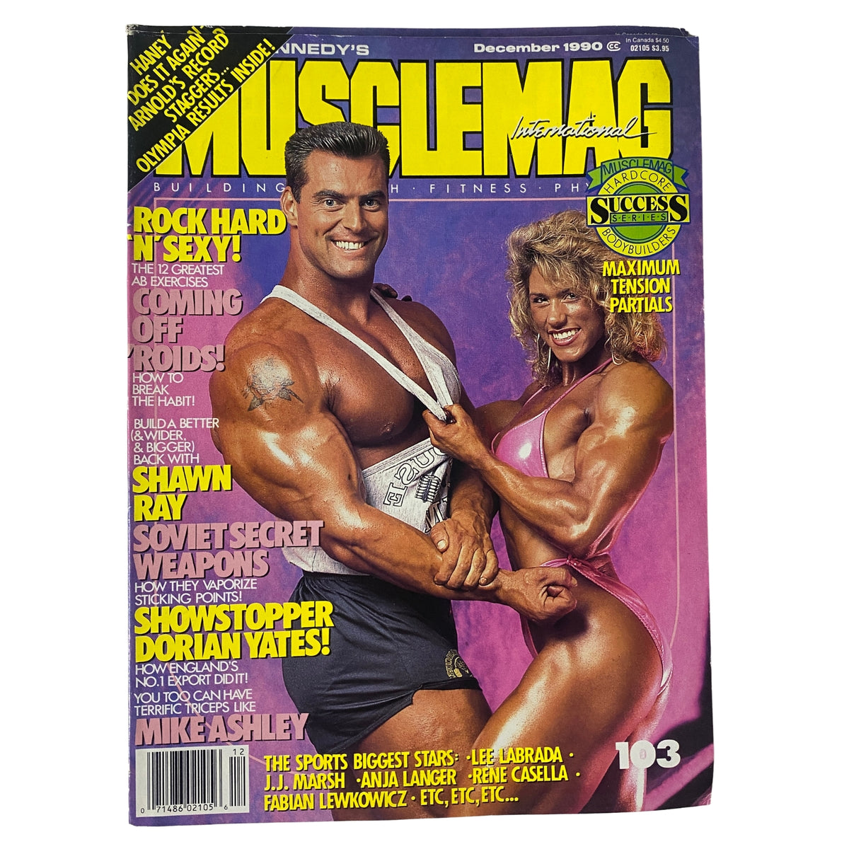 Cover of MuscleMag International Magazine, December 1990, No. 103 featuring Berry DeMey and Shelley Beattie with articles on bodybuilding and fitness.