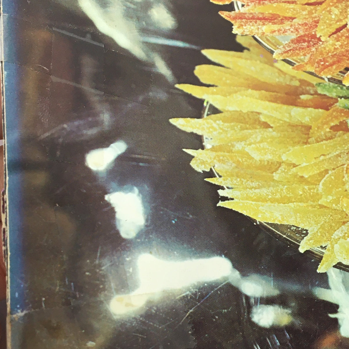 Detail view of decorative dessert on the cover of VTG Gourmet December 1971, showcasing vibrant colors and festive styling.