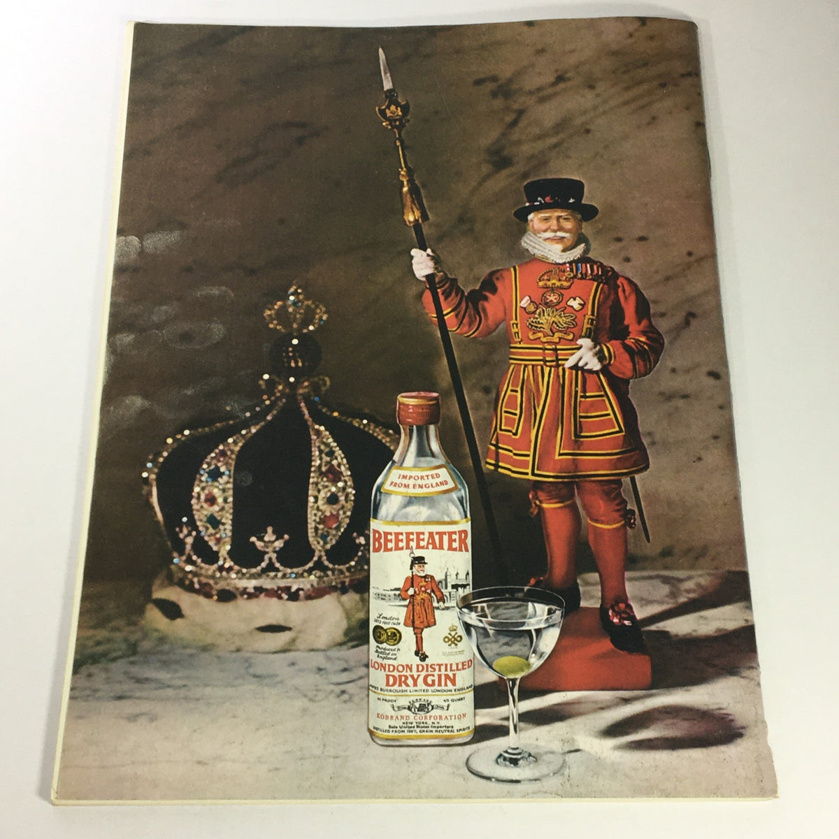 Vintage advertisement featuring Beefeater Dry Gin with a ceremonial Yeoman Warder and crown, highlighting the classic appeal of the era, from the VTG Gourmet Magazine, March 1972.