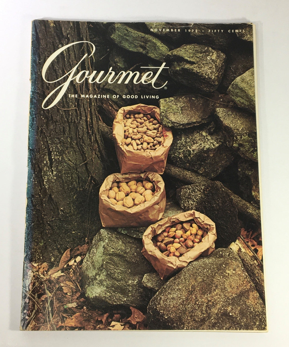Cover of VTG Gourmet The Magazine of Good Living November 1972 featuring bags of nuts against a rustic stone background, embodying the essence of postprandial dining culture.