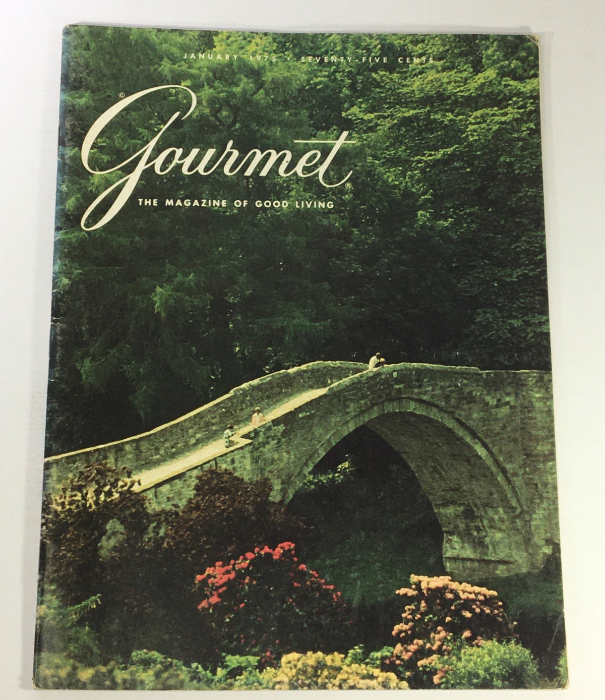 Cover of VTG Gourmet The Magazine of Good Living, January 1975, featuring a serene landscape with a stone bridge and vibrant flowers, showcasing the charm of the Lowlands of Scotland.