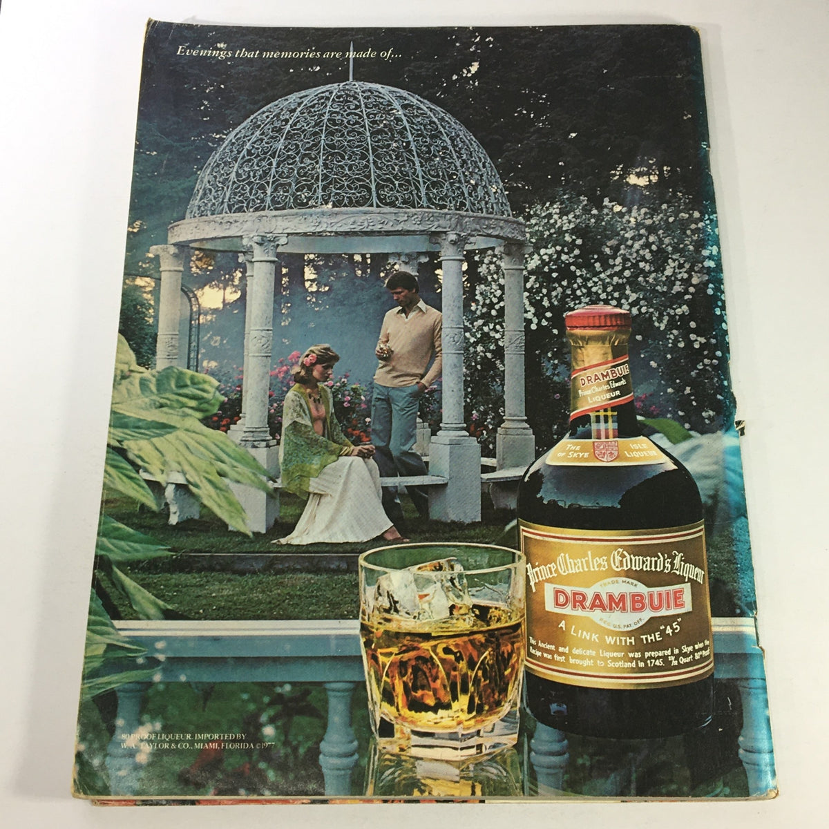 Back cover of VTG Gourmet The Magazine of Good Living November 1977 displaying a romantic outdoor scene with a couple and a bottle of Drambuie.