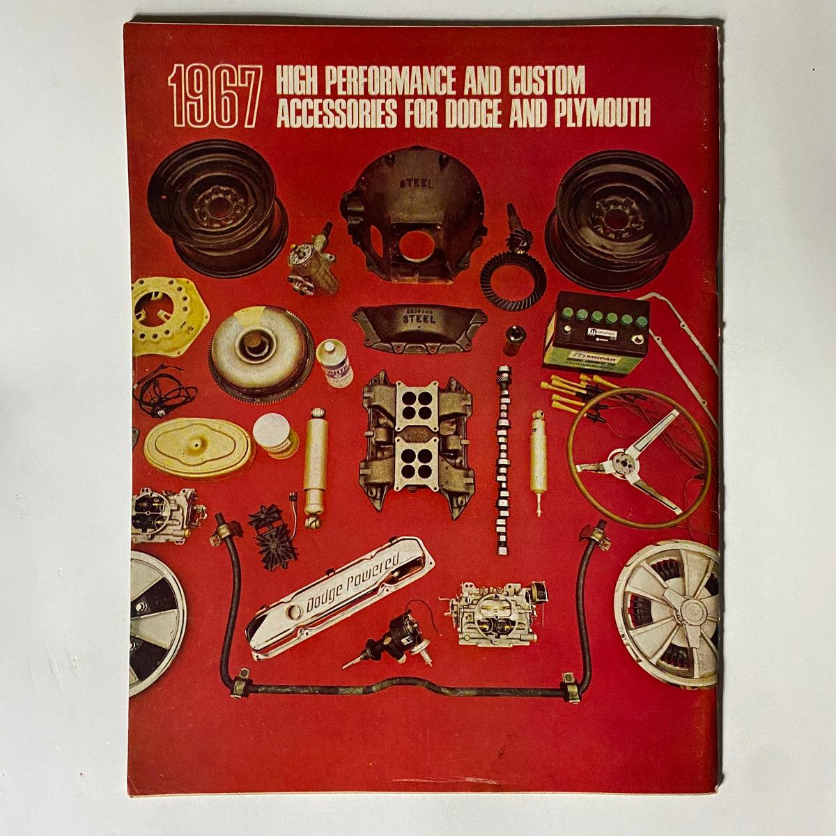 Back cover of high-performance accessories catalog for Dodge and Plymouth from 1967, highlighting various automotive components and detailing custom accessories.