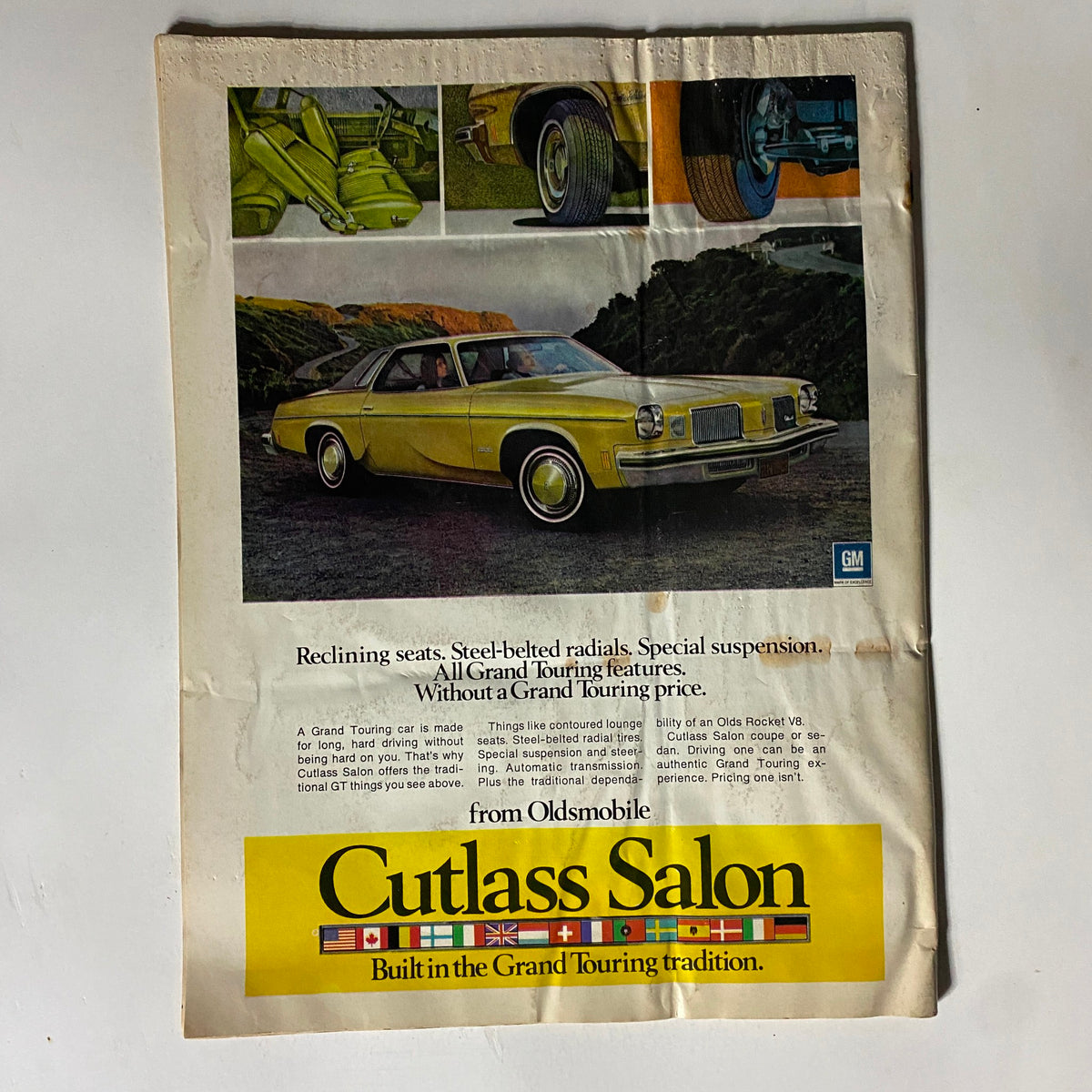 VTG Rod Action Magazine November 1973 advertisement for Oldsmobile Cutlass Salon, highlighting features of grand touring automobiles.