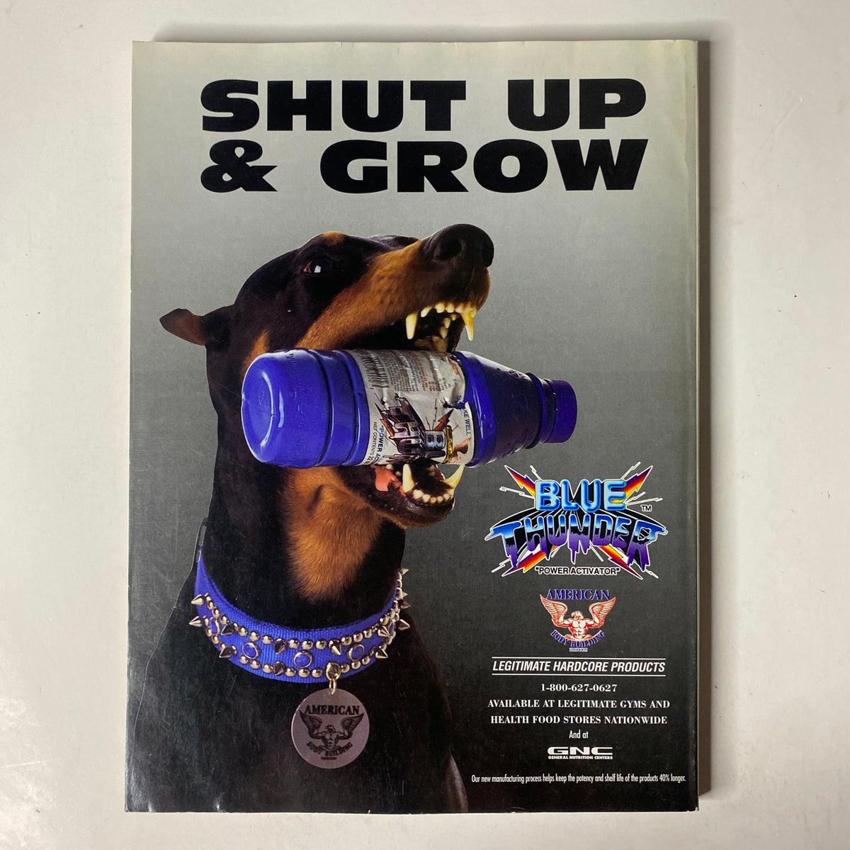 Advertisement from the back cover of MuscleMag International Magazine October 1995 No. 160 featuring a Rottweiler dog with a weight, promoting Blue Chip products for bodybuilding.