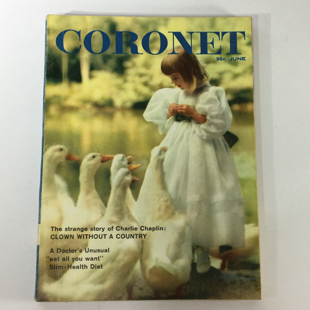 Cover of VTG Coronet Magazine June 1960 featuring Charlie Chaplin, titled 'A Country Without A Clown,' showcasing a young girl in a white dress interacting with ducks by a pond.