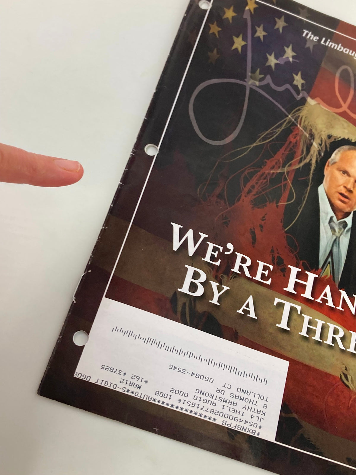 Detail of the Rush Limbaugh Letter Newsletter Magazine August 2010 titled 'We're Hanging By A Thread,' showing the front cover and a finger pointing at the magazine.