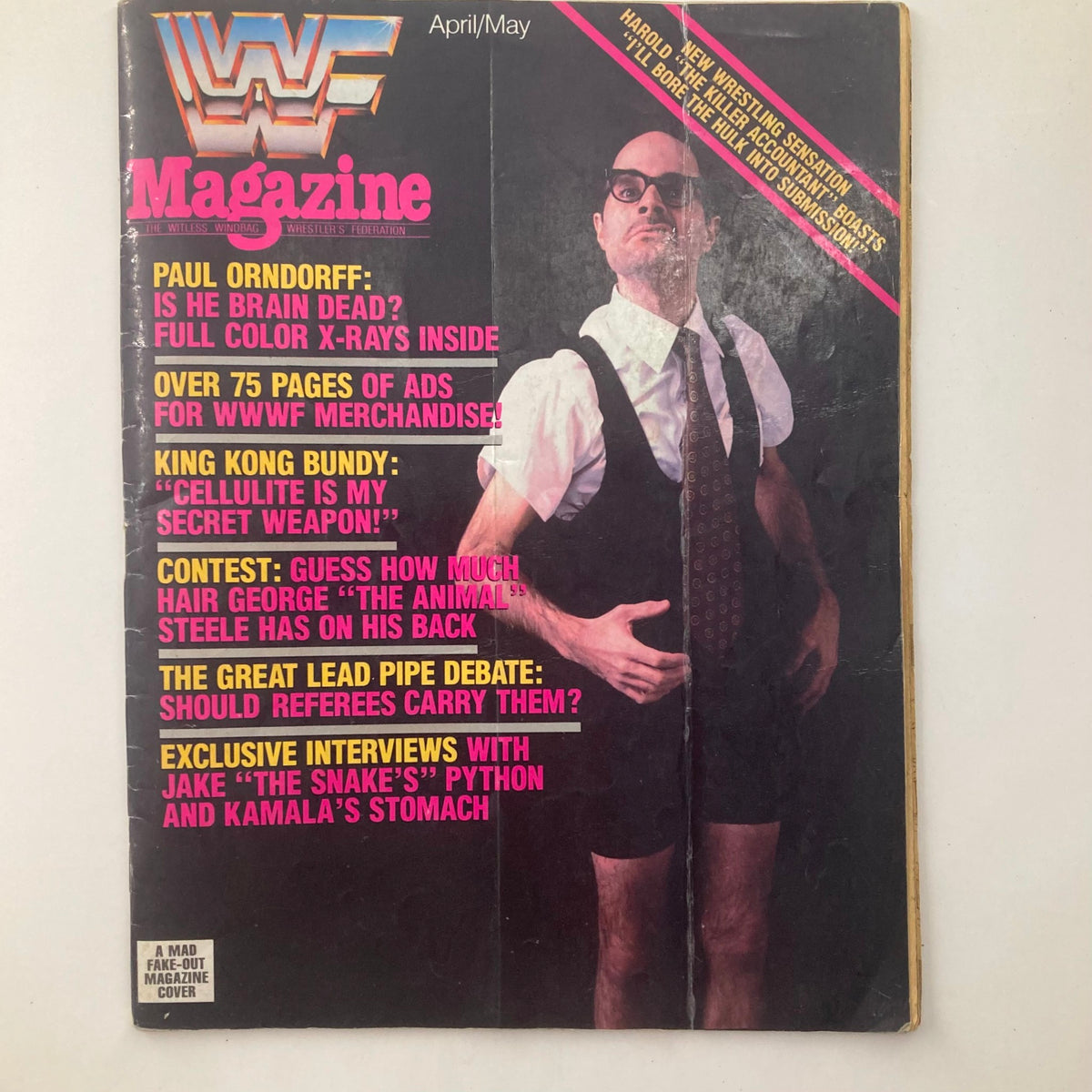 Cover of WWF Magazine April/May featuring satirical content, highlighting humorous articles and colorful graphics.
