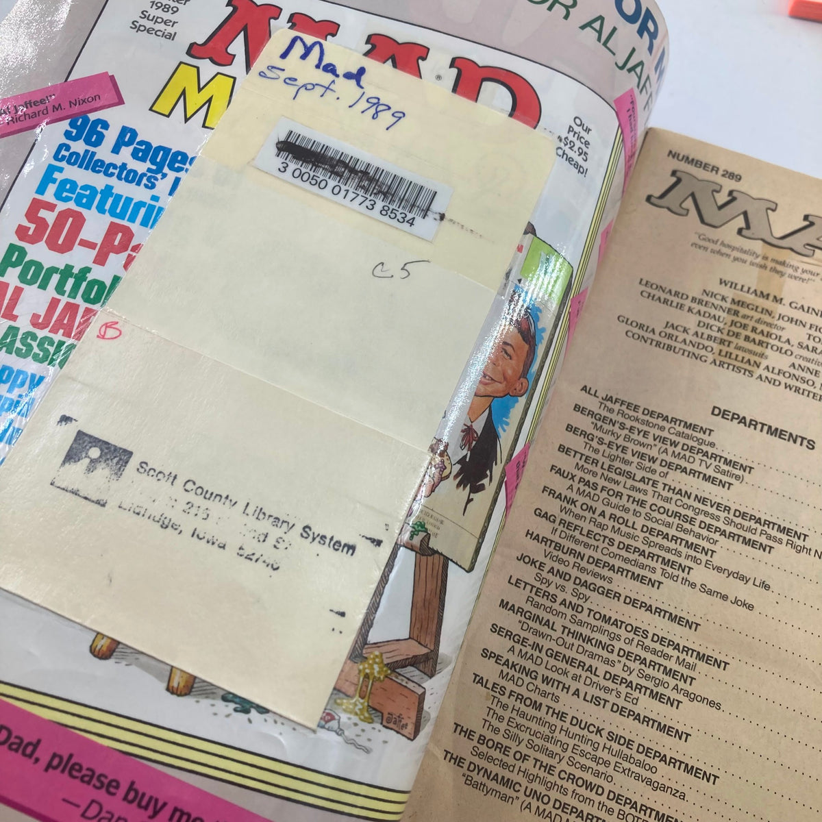 Inside view of Mad Magazine September 1989 No. 289 showing a library sticker and handwritten notes.